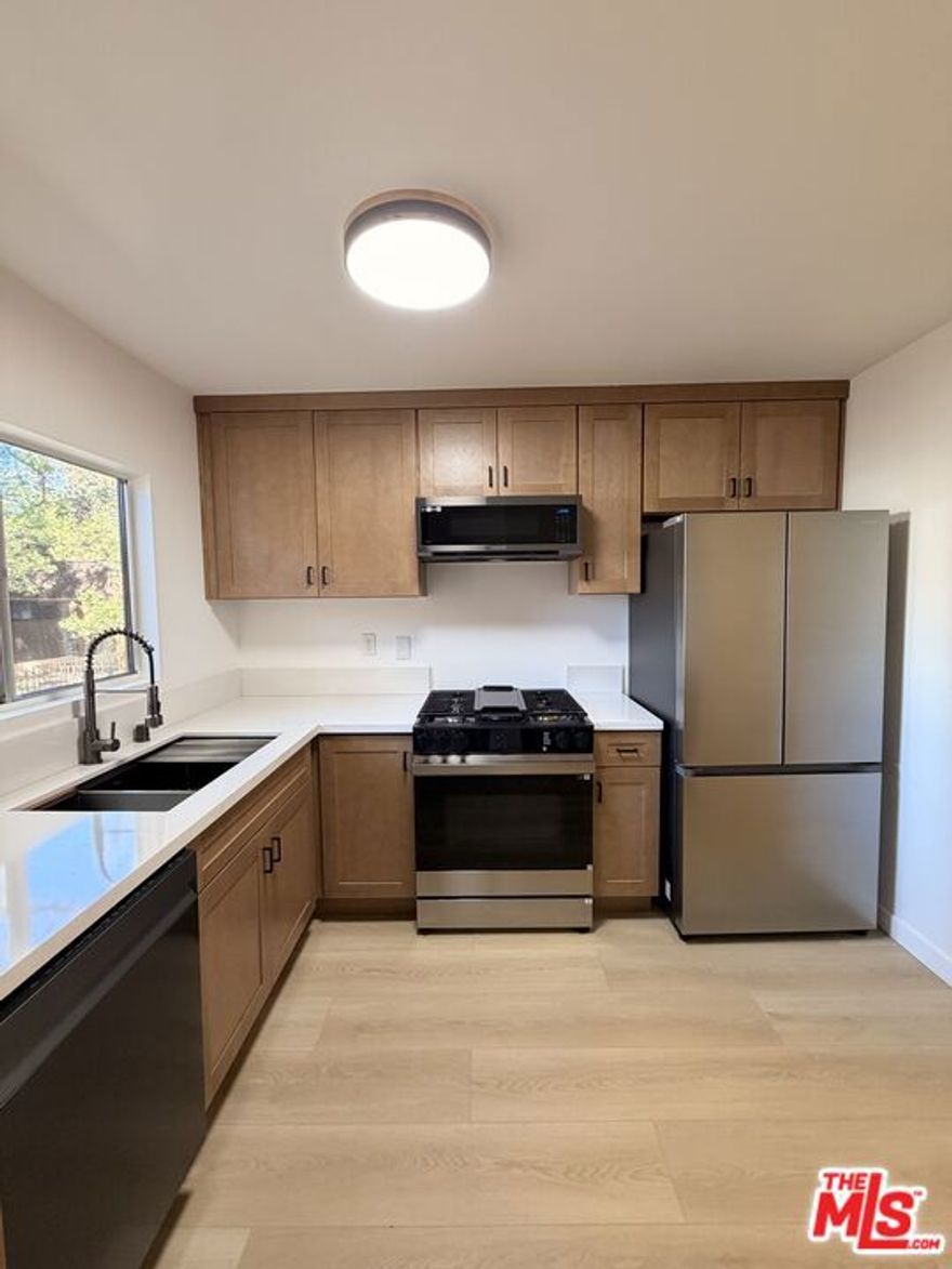 Discover your own private oasis at Tara Village. Enjoy being surrounded by beautiful tree-lined views and lush landscaping in a peaceful park like setting.                                                      This fully remodeled top-floor corner unit offers the perfect blend of privacy, natural light and contemporary design. With 3 spacious bedrooms and 2 full bathrooms - this 1050 SF condominium has been updated with modern and stylish finishes and sleek new appliances. The primary bedroom features a full en-suite bathroom, while the two additional bedrooms provide both space and privacy for family, guests or a home office.                                         Other highlights include in-unit laundry hookups and two carport parking spaces close to the unit. This top floor unit is located in the best spot in the entire complex due to  its close proximity to the front gate and pool area. Tara Village also offers resort-style amenities including a heated swimming pool, soothing spa, fitness center, BBQ/picnic areas and a playground  all within a secure gated community.                                                                                                                                  This move-in-ready home delivers the best of Tara Village living  space, style, and location all in one. Schedule your private showing today and experience the charm of this exceptional home in person!