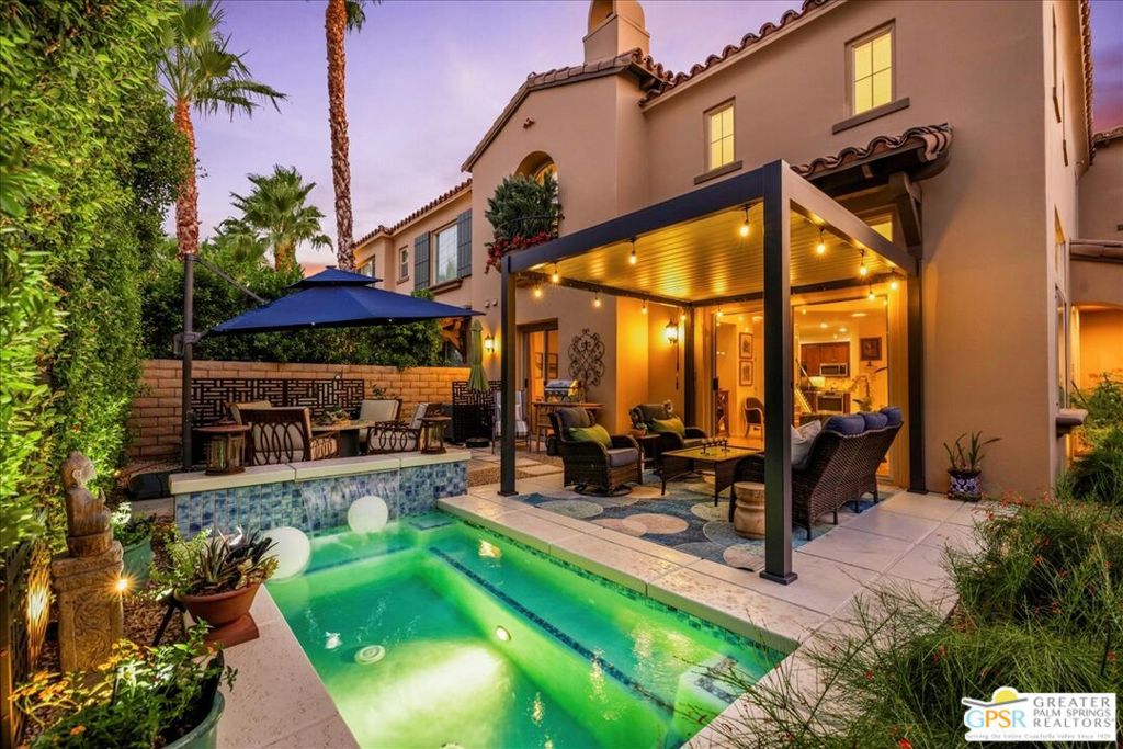 Welcome to your private Mediterranean-inspired retreat in the heart of Palm Springs - perfect as a sophisticated primary residence or a stylish vacation getaway. This elegant home offers 3 spacious bedrooms and 3 bathrooms, blending timeless charm with fresh modern updates. Step inside to soaring ceilings, an inviting fireplace, and an open-concept living space that flows seamlessly into the gourmet kitchen - ideal for both intimate evenings and lively gatherings. The kitchen shines with granite countertops, abundant storage, and brand-new stainless steel appliances including a refrigerator, stove, and dishwasher. Recent upgrades elevate this home's appeal: new carpet, a new HVAC system for year-round comfort, additional LED lighting for a warm, modern glow, and a new louvered patio cover that lets you control shade and sunlight for perfect outdoor enjoyment. Your private backyard oasis is designed for relaxation and entertainment, featuring an app-controlled pool/spa combo, and beautifully refreshed mature landscaping. Upstairs, two generous en-suite bedrooms offer privacy, while the third room is perfect for a home office, media space, or yoga studio. Located in the secure, gated community of Terra Vita, residents enjoy access to a sparkling community pool, spa, and BBQ area - all just minutes from vibrant downtown Palm Springs. This move-in-ready gem combines refined desert living with thoughtful upgradesmaking it the perfect Palm Springs escape.