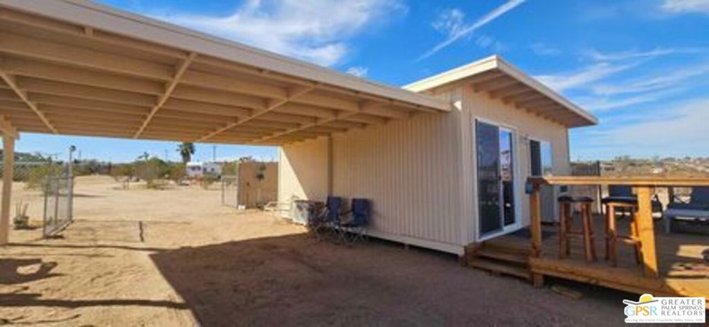 2.5 ACRE CUSTOM HOME SITE with 1bd/1ba STUDIO!!! Views abound on this Hidden River area of Joshua Tree north, with city lights views, water and solar power! Fenced for protection and privacy the studio can be sold turnkey down to the flatware and ready for immediate rental or enjoyment. Already landscaped with mini park dubbed "Hope Ranch" the opportunities are endless for rental, add on to current structure, build your dream home , trailer park, art installation you name it. The neighborhood already has million $ sales and the best sunrises/sunsets you will ever see. Property even comes with vintage trailer plus above ground pool!!! Did I mention EPIC VIEWS!!!