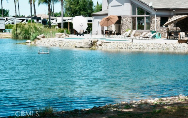 This large pull thru site is located in the gated community of The Lakes RV & Golf Resort. This lot features an enlarged parking pad, end unit for additional privacy, full hook-ups with up to 50-amp service and offers the following amenities: club house, swimming pool, heated spa, laundry room, dog run, and is located within walking distance to the Pheasant Run Golf Course. Tenants receive two rounds of golf daily (restrictions apply) and the HOA provides a rental pool service when you are not using your site. Please review the attached CC & Rs for additional rules this apply to this property. The current owners also have a newer Fifth Wheel trailer that is available as a separate transaction. Please call the listing agent to schedule a showing appointment.