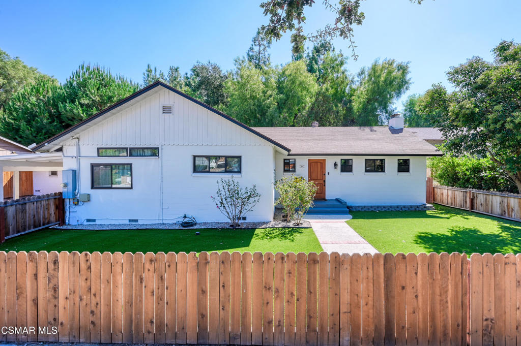 Rare Opportunity in Thousand Oaks! Step into this beautifully renovated single-family gem nestled in the heart of Thousand Oaks. With soaring 14-foot ceilings, the home feels open, airy, and effortlessly inviting. Every detail has been thoughtfully upgraded--from energy-efficient double-paned windows and a sleek slider door, to central heating and air, stylish laminate flooring, and a cozy wood-burning fireplace.Enjoy two generously sized bedrooms and two fully remodeled bathrooms, each showcasing modern, designer finishes. Recessed lighting adds ambiance throughout, while the fenced front yard features low-maintenance artificial turf--perfect for play and curb appeal! The backyard features mature trees and a covered patio, creating a private retreat ideal for relaxing or entertaining. Additional highlights include a covered carport and a separate laundry room building, offering both convenience and flexibility. Just minutes from the Civic Arts Plaza, The Lakes, upscale dining, and so much more! This home blends comfort, style, and lifestyle in one exceptional package.Whether you're a first-time buyer or seasoned investor, this is a rare chance to own a thoughtfully upgraded home in Thousand Oaks!