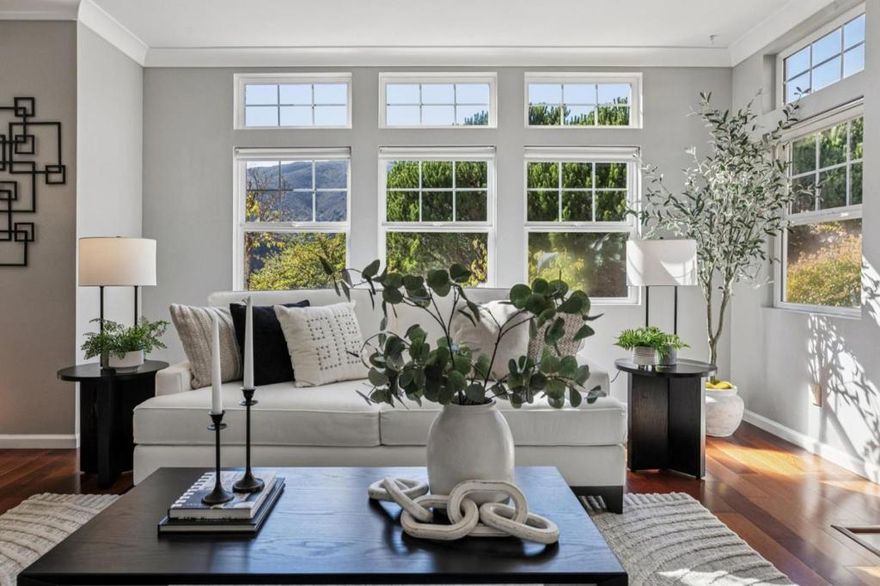 Welcome to this beautifully updated 3-bedroom, 2-bath ground-floor end unit in the desirable Altamar at The Ridge community of historic Brisbane. This rare first-floor corner unit home features the largest floor plan in the complex, offering bright open-concept living, serene mountain views, and two private patios. Enjoy cherry wood floors, soaring ceilings, abundant natural light, and a spacious living room with gas fireplace and patio access. The modern kitchen boasts stainless appliances, breakfast bar, and eat-in nook. The private primary suite includes direct patio access, a walk-in closet, and dual-vanity bath. Two additional bedrooms offer flexibility for guests, office, or gym. Highlights include full-size laundry in-unit, two deeded parking spaces, ample guest parking, and stair-free access to the unit. Residents enjoy a clubhouse, spa, and playgrounds. Tennis, volleyball, and pickleball courts, the Brisbane Community Pool, Mission Blue Center, parks, and hiking trails are all nearby. Brisbane is a hidden gem with sunny weather, small-town charm, and easy access to San Francisco, SFO, and highways 101 & 280. Experience the perfect balance of tranquility and convenience in a nature-surrounded retreat just minutes from the energy of the city.