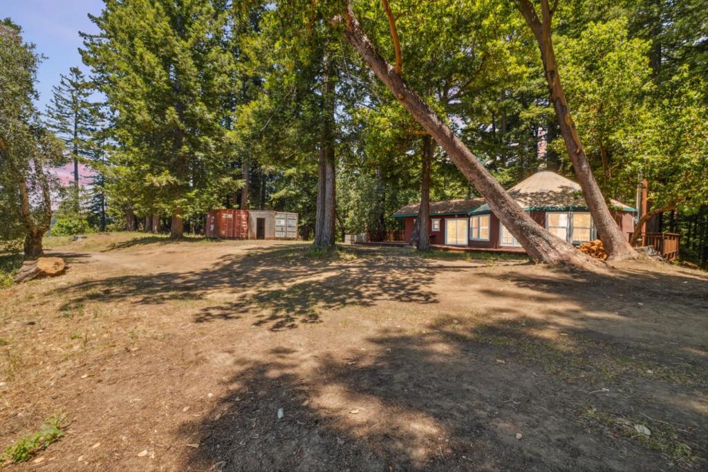 Widge-tastic Widgeway Wonder! (Pwease Wead in Your Best Elmer Fudd Voice) Welcome to your wambunctious widge-top wondewland! Nestled at the very end of a pwivate woad, this sunny, south-facing ~10-acre haven is the stuff of whimsical dweams offewing panoramic vistas, peacefuw secwusion, and peekaboo gwimpses of the majestic Monterey Bay. Features that will make you say That Wascawwy Wabbit! A 30-foot Yurt with real windows, doors and bamboo flooring: perched above the twees, this yurt comes with its own snuggly mudwoom and bath house, all atop a wrapawound wedwood deck blending wustic charm with a dash of glamping wuxury. Enjoy a pwivate well, water storage tanks, sowar panels, and the secuwity of weliable Verizon cell sewvice. You can stay connected when you want, or disappear into the woods when you don't! Expansive views, twanquil secwusion, and cweative potential await whether you seek a pwivate retweat, an awtists haven, or the perfect spot for your next big dweam. Why you will Faww in Wove: its a whimsical canvas for your imagination. Whether you are looking to escape the hustle, paint the next masterpiece, or just wisten to the wind in the wedwoods, 1 Wedwood Widge Way is weady to welcome you home. Whatcha think of this widge-top wonder?