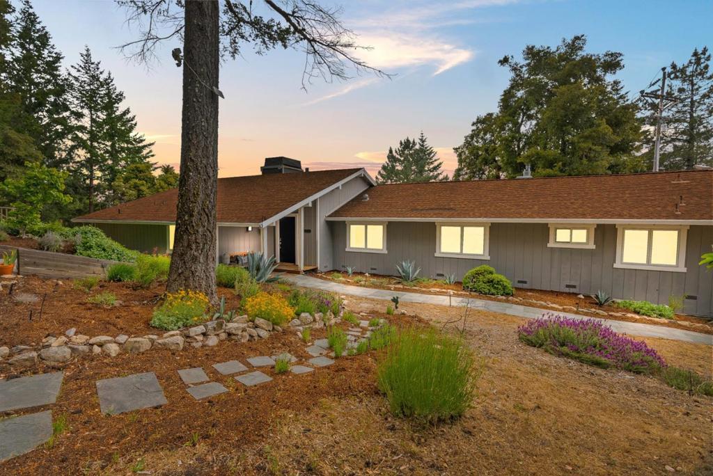 Rare property on 10+ acres within the Indian Rock Ranch gated community, minutes from Saratoga. Main house features 25 ft vaulted ceilings with plenty of natural light, framing awe-inspiring mountain and ocean peek views. Beautifully remodeled bedrooms and bathrooms have an abundance of natural light. Go off grid with a 7kWh SunPower solar system and 3 Tesla Powerwall batteries, plus generator hookups. Many energy-efficient upgrades throughout. Smart Home features include light/fan switches, thermostats, smoke alarms, irrigation control, and motorized shades. Beyond the main house, the property features a 400 sq ft guest house to host guests or provide rental income. 5000 sq ft of barn and workshop space, comprising two well-maintained horse barns with 15 stalls + tack, a pole barn/workshop with a completely open floor plan, plus a 5000 sq ft sand riding arena. The neighborhoods private roads provide easy access to Castle Rock Park and Skyline to the Sea trails for avid hikers/bikers