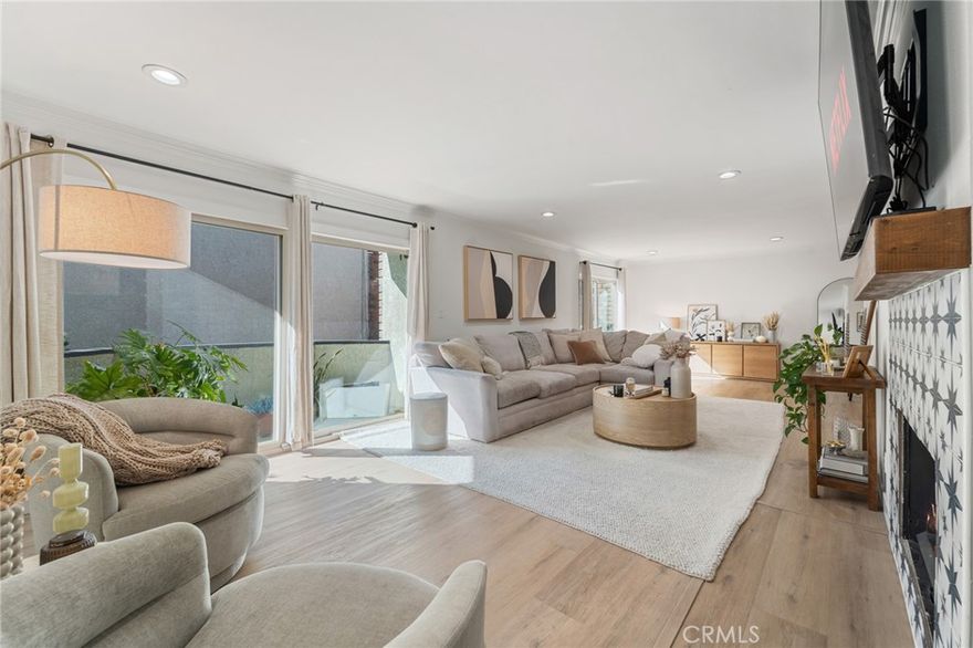 Welcome to this stunning, fully renovated corner-unit condo in the desirable Lindbrook community of Encino! This spacious 2-bedroom, 2-bath residence combines modern upgrades, open-concept living, and resort-style amenities — all with no shared walls for exceptional privacy. Step through the entry into a bright, inviting living room featuring a decorative fireplace, custom wet bar, and recessed lighting. The open kitchen and dining area flow seamlessly together, showcasing all new stainless steel appliances and stylish finishes throughout. Beautiful new laminate hardwood flooring, all new windows, fresh paint, and crown molding elevate the space, while both bathrooms have been tastefully updated — including a completely remodeled primary bath, gutted and redone with contemporary design and quality craftsmanship. Additional highlights include new HVAC (installed in 2022), brand new in-unit washer/dryer, and a covered parking garage with two side-by-side spaces. The HOA recently replaced all community roofs within the past year, offering added peace of mind and value. The spacious primary suite offers double-door entry, a vanity area, and three closets — including a walk-in. As part of the sought-after Lindbrook complex, residents enjoy lush landscaping, a sparkling pool, spa, courtyards, and a recreation room. Ideally located between Burbank and Ventura Blvd, this rare street-facing corner unit offers the perfect blend of comfort, privacy, and style in the heart of Encino.