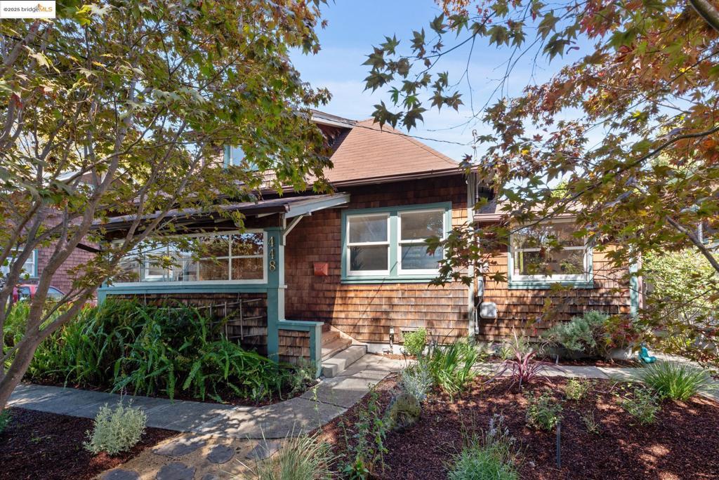 Ever wanted your own little compound - a place where you can tend to your garden, host a friend in the studio, or simply sip your morning coffee on a quiet deck? 448 62nd St fits the bill with multiple spaces offering a variety of living options. The main home is warm and inviting with 1 bedroom, 1 bath, and a lofted bonus space perfect for a kids room or office. Inlay hardwood floors run through the living and dining areas, while the light-filled kitchen opens to an inviting back deck. Step down into the backyard and you’ll find planter boxes ready for your tomatoes, an orange tree and various native, draught-tolerant plants. Across the lawn is a studio with its own bathroom — a creative space, a guest retreat, or simply your quiet corner. A small garage with laundry and storage space completes the property. Although the driveway can accommodate multiple cars, feel free to leave them at home as 448 62nd St is ideally located on a tree-lined block situated between Telegraph and College Avenues. Access to prime Rockridge shops such as Cole Coffee and La Farine are only 3 blocks away, while commuting options to UC Berkeley and San Francisco are even closer. A classic brown-shingle, 448 62nd St is whatever you make of it, but above all it’s a home with soul.