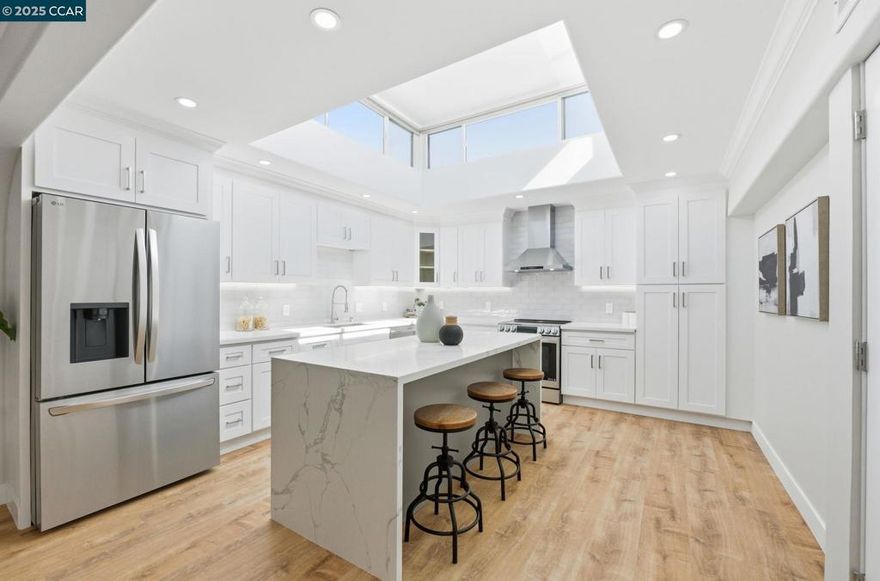Expertly remodeled by Rossmoor Renovations, this expanded 2 bedroom / 2 bath level-in San Franciscan blends thoughtful design, modern elegance, and spacious comfort. The inviting open-concept layout seamlessly connects the kitchen, dining, and living areas—creating an airy, light-filled space perfect for both everyday living and entertaining. The chef’s kitchen is the centerpiece of the home, featuring a striking quartz waterfall island, custom cabinetry, and a full suite of stainless-steel appliances. In the entry closet there is an in-unit washer/dryer as well. Sophisticated design elements—tray ceilings, recessed lighting, a custom fireplace, and detailed wainscoting—add warmth and character throughout. The primary suite offers a generous ensuite bathroom with a walk-in shower and designer tile finishes, while the guest bath echoes the same spa-like quality. Walls of Anlin Del Mar double-pane windows, along with two skylights and a cupola above the kitchen, fill the home with natural light. Every element has been carefully curated with premium materials and timeless style. Spacious, refined, and move-in ready—this home captures the best of Rossmoor living.