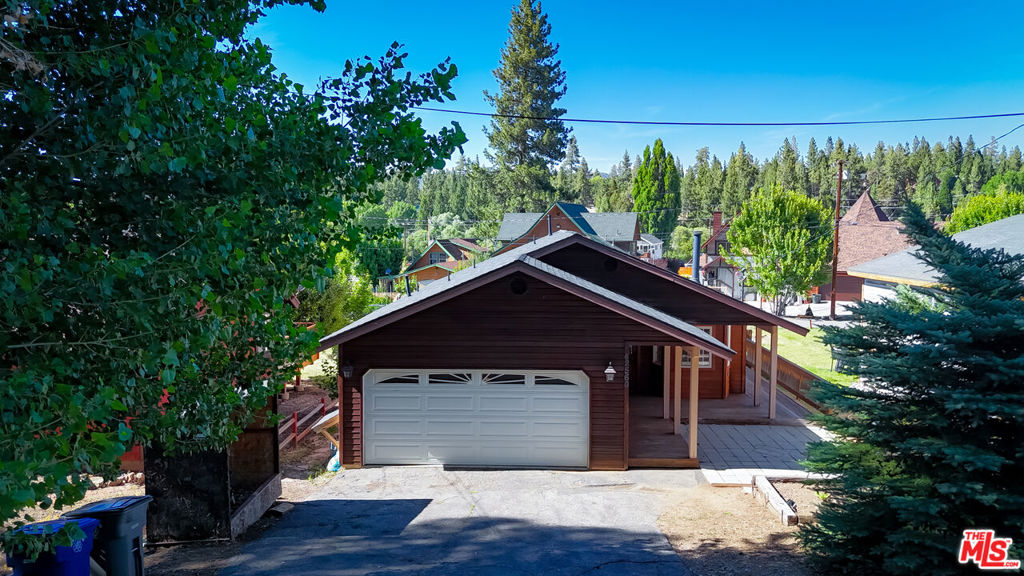 Excellent opportunity to own a 3 bedroom, 2 bathroom custom-built house in Big Bear Lake. This well-designed property features an open floor plan, tile and carpet flooring, and a cozy fireplace, creating a warm and inviting atmosphere. The fully fenced backyard ensures privacy, while the rear wooden deck and outdoor hot tub offer a perfect space for relaxation. Additional highlights include an attached two car garage and extra storage space beneath the home. Ideally situated between ski resorts and within walking distance of the Big Bear Alpine Zoo and various shops, this home is perfect as a primary residence, vacation retreat, or an income generating rental property for both short and long term stays.