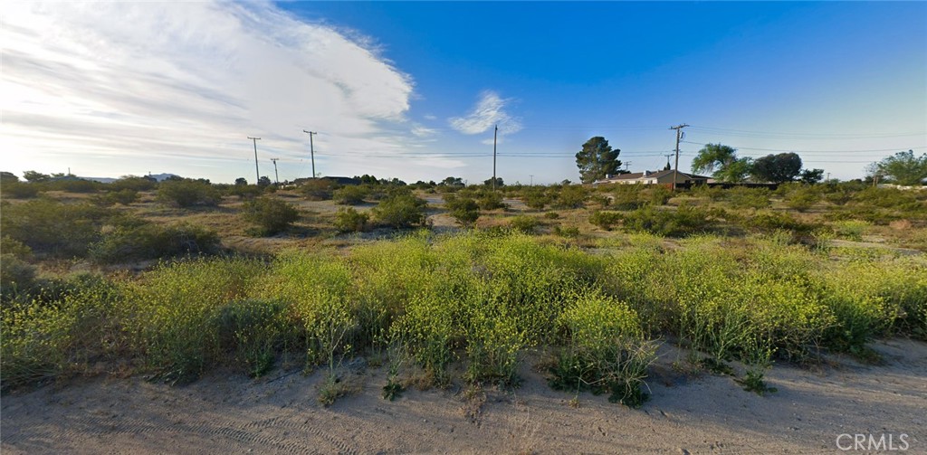 Build-ready quarter-acre lot on paved Ives Drive in California City offers immediate development potential with all essential utilities at the street. This 0.24-acre flat parcel features electricity, water, and public sewer connections available, eliminating costly hookup delays for your residential project. Located in Kern County's fastest-growing community, the lot sits in an established neighborhood with paved road access and residential zoning allowing custom homes or investment properties. California City's strategic Mojave Desert location provides affordable land ownership with room for growth, perfect for first-time builders, investors, or those seeking off-grid adjacent living with city conveniences. Desert terrain requires minimal grading, keeping construction costs manageable while the flat topography accommodates various home designs. The parcel's positioning in this expanding high-desert community offers long-term appreciation potential as infrastructure and amenities continue developing. Ready for permits and construction with utilities staged and road access secured. APN 212-311-07-00-3.