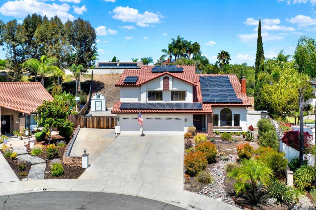 Tucked away on a quiet cul-de-sac, discover the coveted Polo model in Rancho Arbolitos! This 5-bedroom, 3-bath home features a versatile floor plan with a convenient downstairs bedroom and full bath, plus valuable upgrades including a NEW roof (2024), sparkling pool/spa, an OWNED 40-panel solar system, outstanding elevated deck for entertaining, spacious side yards and RV parking. Upstairs, a spacious bonus room offers endless flexibility—ideal as a media room, playroom, gym, or home office. ADU potential. Step inside to soaring ceilings and light-filled living areas that create an open, inviting atmosphere. The formal living and dining rooms flow seamlessly into the family room, while the kitchen provides ample storage and a layout designed for both everyday living and entertaining. Outdoor living shines with a sparkling pool and spa, an elevated entertaining deck, and a spacious backyard with side storage. Located in one of Poway’s most desirable neighborhoods, this home enjoys access to award-winning Poway Unified schools, nearby parks, trails, and optional membership at the Rancho Arbolitos Swim & Tennis Club. With its central location nearby Amazon Fresh, Target, and some of the best shopping in the surrounding area, this property blends comfort, flexibility, and lifestyle in the heart of Poway.