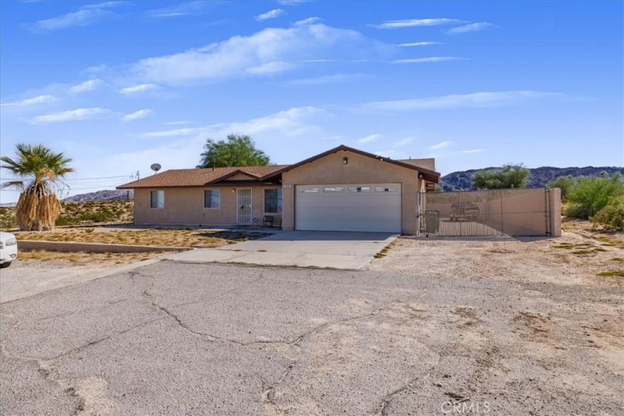 Desert living with a view! This well-maintained 3-bedroom, 2-bath home sits on over half an acre and offers stunning panoramic desert views, just minutes from downtown 29 Palms and a short drive to Joshua Tree National Park. Inside, you’ll find a spacious living room, formal dining area, and a bright, open kitchen. The master suite includes a private bath, and the home is equipped with central A/C, updated dual-pane windows, and a newer roof for added comfort. Whether you're looking for a full-time residence or a desert retreat, this move-in-ready home offers space, serenity, and potential. Don’t miss your chance to own a piece of the high desert! Call me to schedule a private viewing.