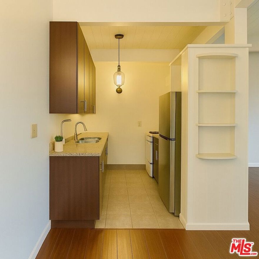 13th Month Free Beverly Hills Apartment for Rent Bright and spacious 1-bed, 1-bath second-floor unit on a quiet, tree-lined street in Beverly Hills. Prime location: 6 minutes to the Beverly Hills Golden Triangle, 3 minutes to Doheny Park, 5 minutes to Bristol Farms, and zoned for Beverly Hills Unified Schools. The unit offers an open living area with great natural light, updated kitchen with modern appliances, classic tiled bath, and warm wood-style floors. Well-kept building with one assigned parking space and on-site laundry. Lease special: sign a 12-month lease and receive the 13th month free. Available now in one of Beverly Hills' most desirable neighborhoods.