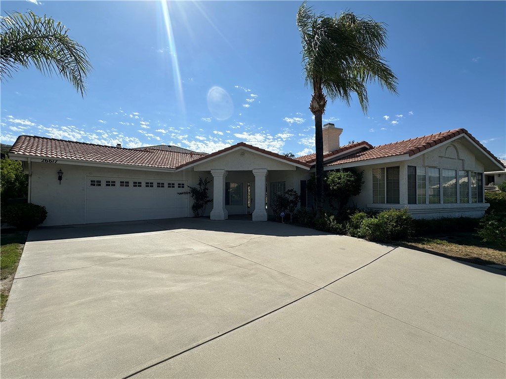 Beautiful single-story home located in an exclusive, hidden neighborhood in the highly desirable hills of East Hemet. This 3-bedroom, 2-bath home offers spacious open areas that blend for entertaining and comfortable living. The formal living room features an oversized fireplace, which adds elegance to the room. The convenient kitchen has gray granite countertops, quality appliances, and is adjacent to the breakfast nook. The Primary Suite has a large Primary bath with a custom jacuzzi, shower, two sinks, and a large walk-in closet. All bedrooms are spacious. There are beautiful laminate floors throughout, a separate inside laundry room, and several outdoor patios. There is an oversized 2-car garage. The home is set back from the street with a slightly sloping driveway. You'll love this exclusive neighborhood!