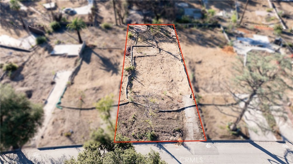 Located east of Lake Ave, south and west of Mount Curve Ave, and north of Wapello Street, this desirable parcel offers approximately 7,500 SF of land per the LA County Assessor. The property has undergone Phase 2 debris removal performed by the Army Corps of Engineers. This rectangular lot is situated on the south side of Concha Street. Neighborhood infrastructure includes county paved road, curbs, electrical/utility poles (in rear of lot), water, and county sewer. Although not a cul-de-sac, this portion of Concha Street ends at the east where it intersects with Mount Curve Ave, minimizing traffic compared to other streets nearby. The lot shape is rectangular with a slight slope southward. Per the LA County Assessor the lot's dimensions are approximately 49 feet wide by 153 feet deep - buyer to independently verify. The lot is zoned LCR 175 – low density residential. The prior home was destroyed by the Eaton Fire, it was a 2 bedroom-1 bathroom 1946 Traditional-style SFR with 1,258 SF of living space. Prior to the fire the home had a sewer, water, electric, and gas stubbed to the site. Interested buyers are advised to independently investigate potential future uses and parcel remediation processes with the County of Los Angeles and applicable government agencies. For safety purposes, please do not walk on the property, drive-by only. Fairly priced at approximately $80 per SF of land (based on LA County Assessor SF number of 7,500 SF). Property shall be sold "as-is," in its present physical condition. Although Phase 2 debris removal has been completed the seller makes no assurances the county will permit building without further soil remediation or soil testing.