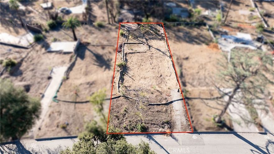 Located east of Lake Ave, south and west of Mount Curve Ave, and north of Wapello Street, this desirable parcel offers approximately 7,500 SF of land per the LA County Assessor. The property has undergone Phase 2 debris removal performed by the Army Corps of Engineers. This rectangular lot is situated on the south side of Concha Street. Neighborhood infrastructure includes county paved road, curbs, electrical/utility poles (in rear of lot), water, and county sewer. Although not a cul-de-sac, this portion of Concha Street ends at the east where it intersects with Mount Curve Ave, minimizing traffic compared to other streets nearby. The lot shape is rectangular with a slight slope southward. Per the LA County Assessor the lot's dimensions are approximately 49 feet wide by 153 feet deep - buyer to independently verify. The lot is zoned LCR 175 – low density residential. The prior home was destroyed by the Eaton Fire, it was a 2 bedroom-1 bathroom 1946 Traditional-style SFR with 1,258 SF of living space. Prior to the fire the home had a sewer, water, electric, and gas stubbed to the site. Interested buyers are advised to independently investigate potential future uses and parcel remediation processes with the County of Los Angeles and applicable government agencies. For safety purposes, please do not walk on the property, drive-by only. Fairly priced at approximately $80 per SF of land (based on LA County Assessor SF number of 7,500 SF). Property shall be sold "as-is," in its present physical condition. Although Phase 2 debris removal has been completed the seller makes no assurances the county will permit building without further soil remediation or soil testing.