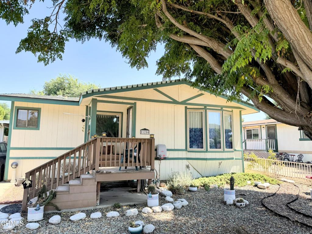 Welcome to 21250 Maple St, Wildomar, CA, a place where you can truly make your home dreams a reality. This property offers an incredible opportunity with a generous lot size of over 7,800 square feet, providing a fantastic canvas for your personal touches. Imagine the possibilities, a sprawling garden, a custom patio for entertaining, or even a large play area. There's ample room to create the outdoor oasis you've always wanted.Inside, you'll find a comfortable 2-bedroom, 2-bathroom home. The property features central air conditioning, ensuring comfort year-round. Best of all, the house is equipped with a solar system, making those hot Wildomar days more manageable and significantly reducing your energy bills. This is a chance to own a home with a spacious feel both inside and out, offering the perfect blend of comfort and potential