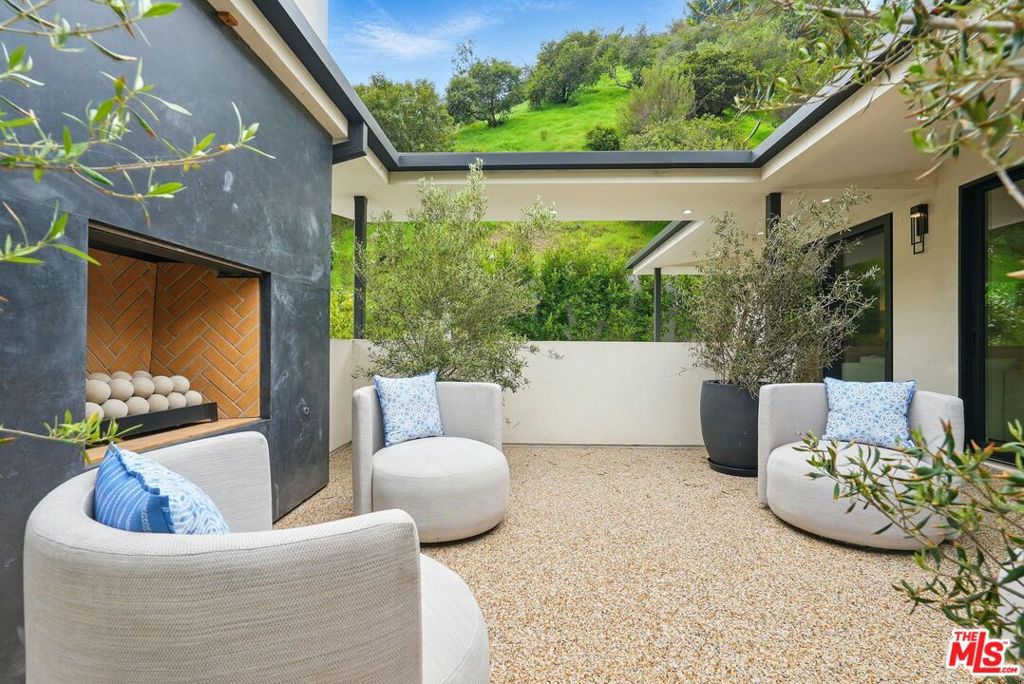 913 North Beverly Glen: Exquisite Home in Bel Air Offered fully furnished, with short- or long-term rental options available. This stunning 2025 new-construction masterpiece seamlessly blends luxury, functionality, and cutting-edge design with premium finishes. The house at 913 N. Beverly Glen offers 3 spacious bedrooms and 3 luxurious bathrooms. The primary suite is a true retreat, complete with dual vanities, a spa-inspired bathroom, and ample closet space. The state-of-the-art chef's kitchen, equipped with Miele appliances, is perfect for entertaining, while the open-concept living area flows effortlessly, filled with natural light and sleek, contemporary touches. Step outside to a private outdoor terrace with a cozy fireplace, ideal for relaxing or hosting guests. Nestled in the prestigious Warner School District, this rare Bel Air gem offers unmatched elegance and versatility for 2025's discerning elite. Contact us today for leasing details or to schedule a private tour of this extraordinary property!