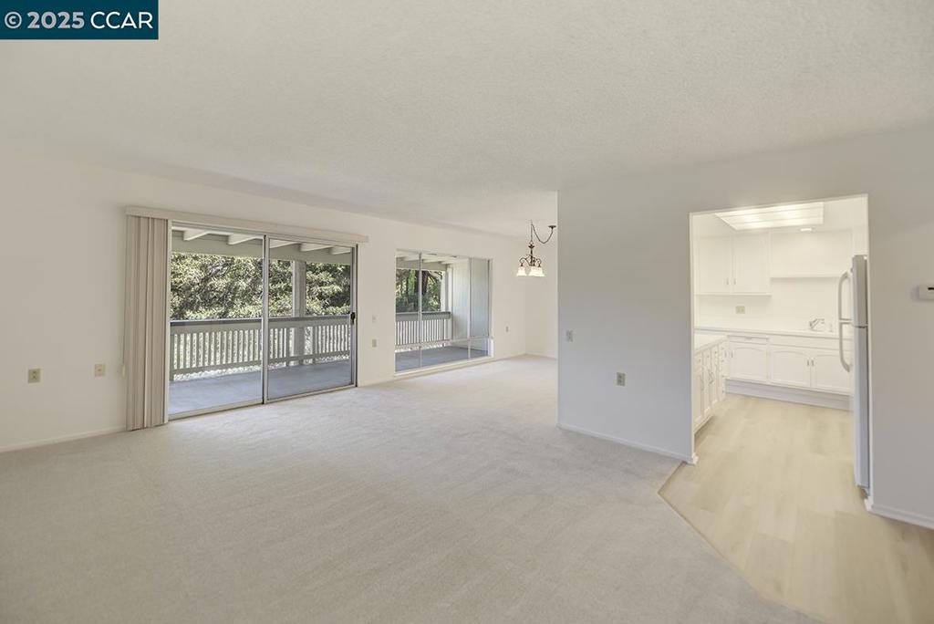 Effortless living in this light-filled upper unit is just a short stroll to the Gateway Clubhouse, Farmers Market, movie theater, and more. Freshly painted with luxury plank flooring and brand-new carpet, the home feels stylish and move-in ready. The bright white kitchen offers clean, modern lines, while the bathroom is filled with natural light from the skylight and features a walk-in shower for easy access. Enjoy the convenience of an in-unit stackable washer and dryer. Perfect for those looking to embrace the Rossmoor lifestyle without compromising on value—this home is priced to fit a variety of budgets. Unpack your bags and start your next chapter in this vibrant, amenity-rich community!
