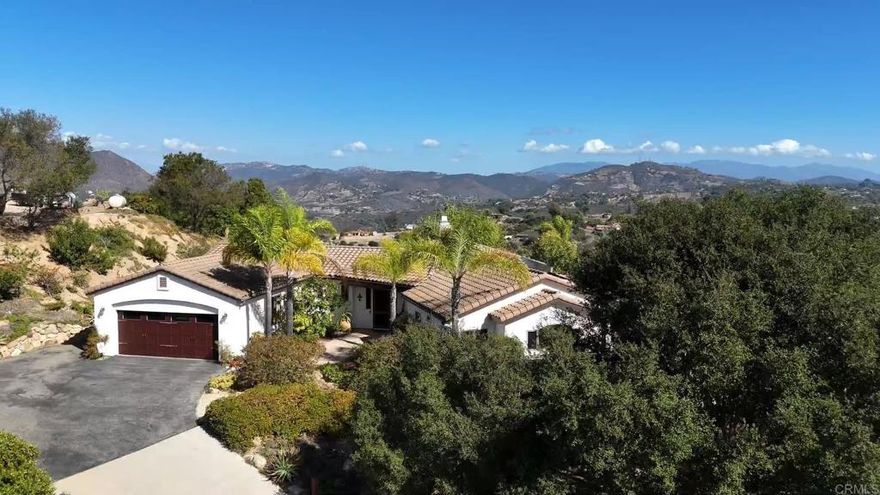 Beautiful single-story custom home on a hill with mountain views from both the front and back yards. Thoughtfully landscaped garden setting with owned solar. Custom counters, fixtures, and floors throughout. Split layout with primary suite separate from secondary bedrooms and baths. Oversized wood-framed windows in every room bring in abundant natural light. Excellent condition and move-in ready — experience the comfort and tranquility this home provides.