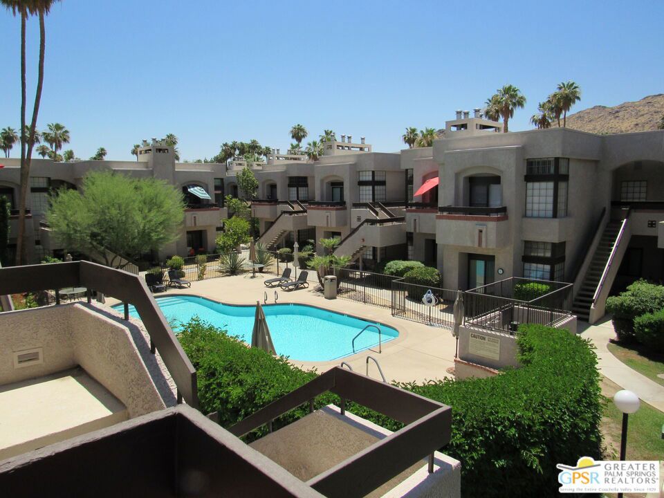 Welcome to this move-in ready, 2-bedroom, 2-bath upstairs condo located in a highly desirable Palm Springs community. This spacious unit offers a bright and open floor plan with excellent separation between the living area and bedrooms, enhanced by a custom glass door that adds style and privacy. Enjoy tasteful upgrades throughout, including 20-inch tile flooring, crown molding in the living room and bedrooms, and a cozy fireplace perfect for relaxing evenings. The kitchen and bathrooms have been updated with newer vanities and custom tile showers. Both bedrooms are generously sized, each with ample closet space and a tranquil feel. The living room provides beautiful views of the community pool and breathtaking Palm Springs mountains. Ideally located just minutes from shopping, dining, downtown Palm Springs, and the airport. Whether you're looking for a primary residence, vacation home, or investment property, this condo is a true desert gem.