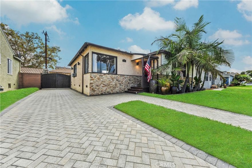 Step into this gorgeous resort-like pool home in one of the quiet cul-de-sacs of Downey, that is perfect for relaxing and entertaining.  From the moment you arrive you will be welcomed by a trio of palm trees and newly installed cement pavers in the walkway/driveway/ backyard, and travertine stone walls that frame the house both front and back.  Inside, the home offers a comfortable layout of 3 bedrooms which can be closed off from rest of home in case the baby is asleep or your sleeptime varies from other family members.  Romantic chandeliers, ceiling fans, and plenty of natural light create a warm and inviting atmosphere. The restrooms have been updated with carrera marble tile walls, vanity and flooring giving the home an elevated spa-like feel. The suite of kitchen appliances all match.  The backyard is truly a retreat, featuring a sparkling heated pool, new modern tiles and pebble-tech flooring. On one side you can calmly lounge with friends and do aqua-yoga or play volleyball and on the other you can show off your skills and tricks as you jump into the prestine water from atop the diving board and into this 9 ft deep refreshing attraction. Whether it's barbeques, pool parties or simply enjoying a quiet evening outdoor poolside under the stars by a gas-lit fire, this backyard has it all.  Nestled in North Downey, near Wilderness Park, Costco, Smart & Final, Target, Honda World and quick access to the 5 and 605 fwy, this home blends charm, luxury and convenience into one. Don't miss a chance to make this gem of a property your own.