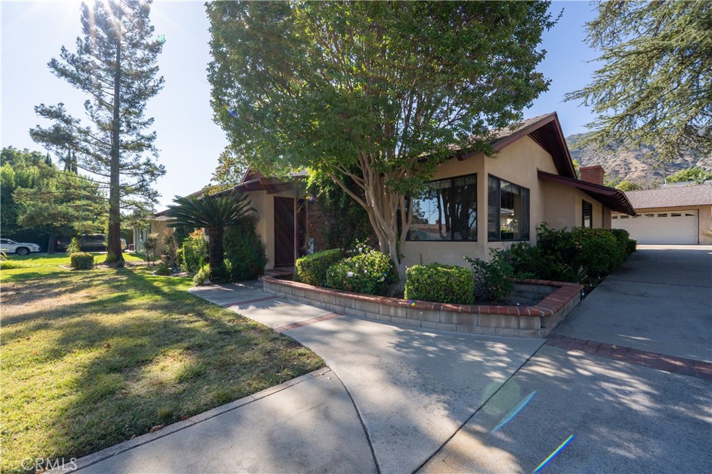 Welcome to 439 W Virginia Avenue – a rare and cherished offering in the heart of North Glendora’s foothill neighborhood. Set on a generous 13,842 sq ft lot, this spacious two-story home offers just over 2,700 sq ft of living space, with 4 bedrooms (including one upstairs), 3 bathrooms, a detached 2-car garage with a workshop, and a sparkling private pool — all nestled in one of Glendora’s most established and picturesque communities. Lovingly cared for by the same family for decades, this home exudes warmth, comfort, and character. From the moment you enter through the front door, you’re welcomed into a home built for gathering, relaxing, and making lifelong memories. The thoughtful layout includes both formal and casual living spaces, with a large family room that opens directly to the backyard, perfect for hosting family barbecues, summer swims, or quiet mornings by the pool. Outdoors, the expansive backyard offers endless enjoyment with ample space to garden, play, entertain, or simply unwind in your own peaceful retreat. The detached two car garage and workshop provide additional space for hobbies, storage, or a private studio setup. You’ll love living in this quiet neighborhood known for its wide, walkable streets, strong community pride, and award-winning Glendora schools. Just minutes from hiking trails, parks, and the vibrant Glendora Village, the location strikes the perfect balance of serenity and convenience. Why Glendora? Why Now? Glendora continues to grow in all the right ways — while holding onto the charm that makes it special: The upcoming Foothill Gold Line Station will bring direct light rail access to Pasadena, DTLA, and beyond, enhancing commuter convenience and community value. Downtown Glendora Village is thriving with local cafés, boutiques, and restaurants that bring neighbors and visitors together year-round. Route 66 revitalization is infusing fresh energy into Glendora’s historic corridor with new shopping, dining, and gathering spots. Top-ranked schools, beautiful neighborhoods, and strong homeownership trends make this one of the most stable and sought-after communities in the San Gabriel Valley. 439 W Virginia Avenue isn’t just a house — it’s a home with a story. A place to create new chapters, celebrate milestones, and enjoy the best of Glendora living. Come experience it for yourself — your future begins here, so make us an offer we can not refuse! Tune back in photos and floor plan to be available soon!