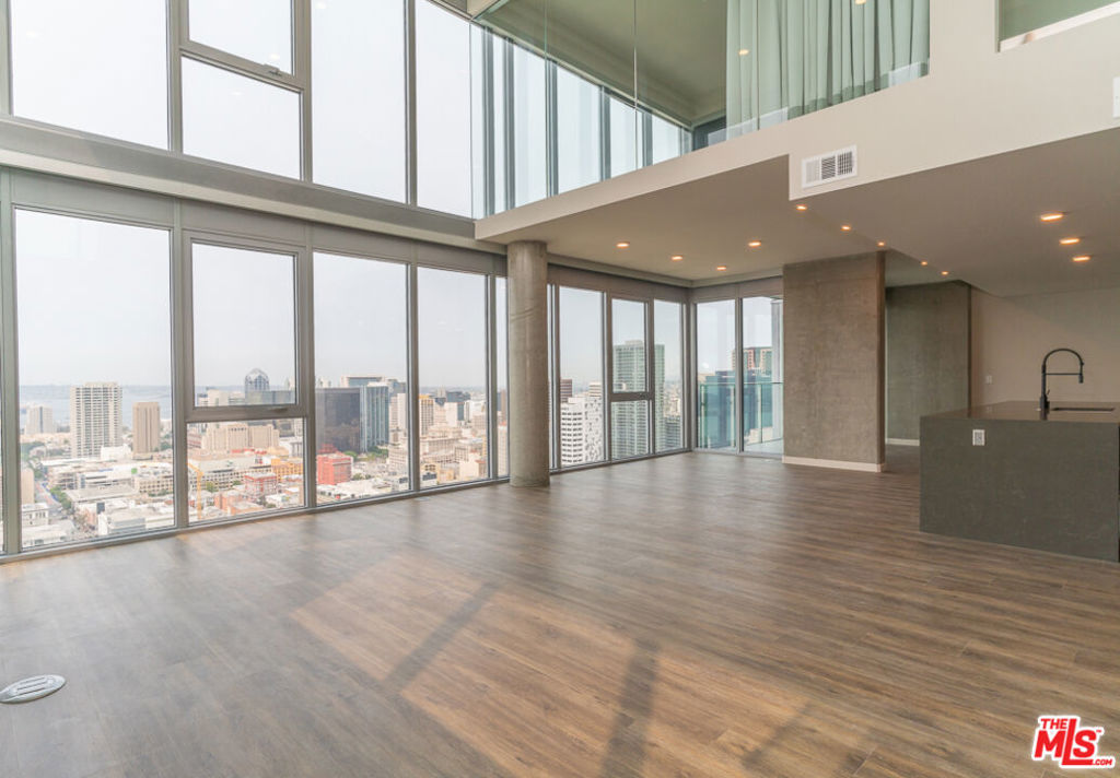 Spanning The Merian's 33rd and 34th floors, and offering the most spectacular views of both the bay and downtown San Diego The Merian Penthouse Collection introduces an unparalleled living experience presenting a new theory of luxury living, comfort, and sophistication in the heart of downtown San Diego's East Village neighborhood. This unique collection of thoughtfully designed residences represent the pinnacle of Southern California living with dual level layouts offering spectacular views, custom designer finishes, and impeccable service and attention to detail which has never before been experienced in San Diego and which sets a new standard of luxury high rise coastal living. Penthouse 3301 offers a multi-level floor plan with floor to ceiling windows featuring breathtaking and sweeping coastal and city views and offers 3,100 sq. ft. of living space featuring 3 bedrooms with walk-in closets, 4 bathrooms, and two additional flex spaces that can be utilized for office, studio, or fitness purposes. Floor-to-ceiling windows and an expansive open kitchen and living room provide abundant light and space and penthouse features include Caesarstone countertops, panelized Sub-Zero Refrigerator, stainless steel wolf appliances, Moen fixtures, Walk in pantry, built in wine fridge, laundry room, customized MasterSuite closet systems, and a private 750 sq. ft. terrace with a gas fire feature overlooking the entire San Diego coastline just to name a few. The Merian is a full service luxury community with a lobby Lounge & coffee bar, concierge, club Room with outdoor Lounge & BBQ, rooftop pool, spa & BBQ area, sky lounge, multi level fitness center with yoga studio, community plaza, amphitheater and terrance with an outdoor Jumbotron, pet spa, EV charging stations, and much more. Located in the East Village, you'll be surrounded with all the thrills of one of San Diego's most vibrant neighborhoods just steps away from Gaslamp District, Petco Park, Balboa Park, and the best that San Diego has to offer. Come experience a new standard, definition, and theory of luxury today at The Merian Penthouse Collection.