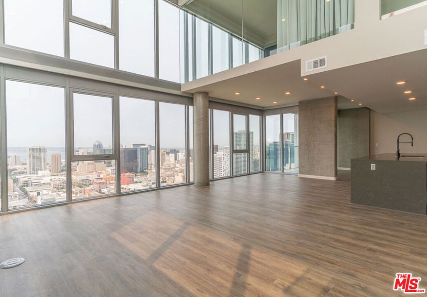 Spanning The Merian's 33rd and 34th floors, and offering the most spectacular views of both the bay and downtown San Diego The Merian Penthouse Collection introduces an unparalleled living experience presenting a new theory of luxury living, comfort, and sophistication in the heart of downtown San Diego's East Village neighborhood. This unique collection of thoughtfully designed residences represent the pinnacle of Southern California living with dual level layouts offering spectacular views, custom designer finishes, and impeccable service and attention to detail which has never before been experienced in San Diego and which sets a new standard of luxury high rise coastal living. Penthouse 3301 offers a multi-level floor plan with floor to ceiling windows featuring breathtaking and sweeping coastal and city views and offers 3,100 sq. ft. of living space featuring 3 bedrooms with walk-in closets, 4 bathrooms, and two additional flex spaces that can be utilized for office, studio, or fitness purposes. Floor-to-ceiling windows and an expansive open kitchen and living room provide abundant light and space and penthouse features include Caesarstone countertops, panelized  Sub-Zero Refrigerator, stainless steel wolf appliances, Moen fixtures, Walk in pantry, built in wine fridge, laundry room, customized MasterSuite closet systems, and a private 750 sq. ft. terrace with a gas fire feature overlooking the entire San Diego coastline just to name a few. The Merian is a full service luxury community with a lobby Lounge & coffee bar, concierge, club Room with outdoor Lounge & BBQ, rooftop pool, spa & BBQ area, sky lounge, multi level fitness center with yoga studio, community plaza, amphitheater and terrance with an outdoor Jumbotron, pet spa, EV charging stations, and much more. Located in the East Village, you'll be surrounded with all the thrills of one of San Diego's most vibrant neighborhoods just steps away from Gaslamp District, Petco Park, Balboa Park, and the best that San Diego has to offer. Come experience a new standard, definition, and theory of luxury today at The Merian Penthouse Collection.