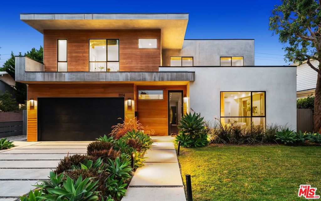 2018 Ultra-High End Construction 5 bed/6 bath, 4,077 sq ft Architectural Masterpiece on a 7,687 sq ft flat lot with resort style and privacy hedged Backyard/Pool/Spa and full house solar, all located in a prime Mar Vista Elementary School District location. Enter to discover magnificent living and family rooms at the front and rear of the residence, each boasting stunning gas fireplaces creating both intimate and grand entertaining spaces w/ high ceilings. VTA-Sandbar hardwood floors throughout connect beautifully appointed living spaces featuring expansive windows and Fleetwood sliding doors in the family room flooding the home with natural light. All 5 bedrooms include en suite baths with 4 bedrooms upstairs and 1 downstairs. Gourmet chef's kitchen features Thermador appliances, dramatic Bianco Molasa center island, walk-in pantry, and separate butler's area w/ sink. Seamless indoor/outdoor flow creates an effortless transition to the spectacular outdoor oasis featuring heated in-ground lap pool with an electric pool cover, and a separate heated spa, complemented by a built-in outdoor BBQ kitchen with refrigerator- perfect for al fresco dining. The luxurious master suite includes a spa-like ensuite bathroom with Sara 67" soaking tub, spacious walk-in shower with built-in seating, skylight-illuminated water closet, and phenomenally large walk-in closet w/ built ins. Additional features include an upstairs large and light filled living/entertainment space, upstairs laundry room w/ sink, multi-zone central air, attached two-car garage with extra storage closet, and much more. This exceptional home truly checks all the boxes. A must see gem!