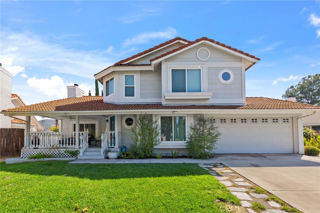 Beautiful South Temecula Entertainers' Delight! This remodeled 4-bedroom home features an inviting floor plan with separate living, dining, and family rooms, along with a stunning remodeled kitchen that overlooks a spacious backyard. You'll love the newly resurfaced PebbleTec pool and the garden areas, which have several spots to relax. Fruit trees include citrus, apples, grapevines, and more. There is a separate pet area on the side and a nice covered patio. The front porch is perfect for enjoying coffee and tea, and the backyard is ideal for evening BBQs. All windows have been replaced, with newer HVAC and solar. There's a full bedroom and bathroom downstairs, and three bedrooms with two bathrooms upstairs. This home sits on an extra-large lot, making it feel like a true getaway!
