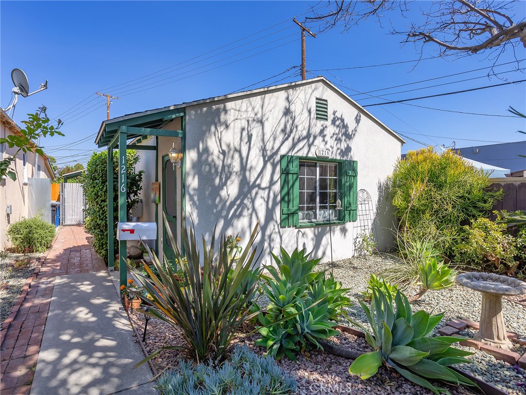 Nestled on a 3,536 square foot lot, this adorable and cozy home offers 1,086 square feet of thoughtfully designed living space. Perfect for first-time buyers or savvy investors, this property is a great opportunity to get into a charming neighborhood. The home features three well-sized bedrooms, each with plenty of natural light, and one beautifully remodeled bathroom that showcases modern finishes while maintaining the home's inviting, warm character. As you enter, you'll be greeted by the durable and stylish Pergo flooring, which flows seamlessly throughout the home. The spacious formal dining room provides a perfect space for entertaining or enjoying family meals. A dedicated laundry area adds convenience, tucked away to keep things neat and organized. For relaxation and outdoor enjoyment, the home boasts a covered patio and a private spa, offering the ideal space to unwind after a long day or host gatherings with friends and family. The primary bedroom is a true highlight, featuring a generous walk-in closet that provides ample storage and organization. The cozy living room is bright and welcoming, creating a perfect spot to relax and enjoy downtime. Whether you're looking for a place to call home or an investment with long-term potential, this property is full of charm, offers great functionality, and is ready for you to move right in. Don't miss out on this fantastic opportunity! Tax assessor shows 1 bedroom and 2 bathrooms.