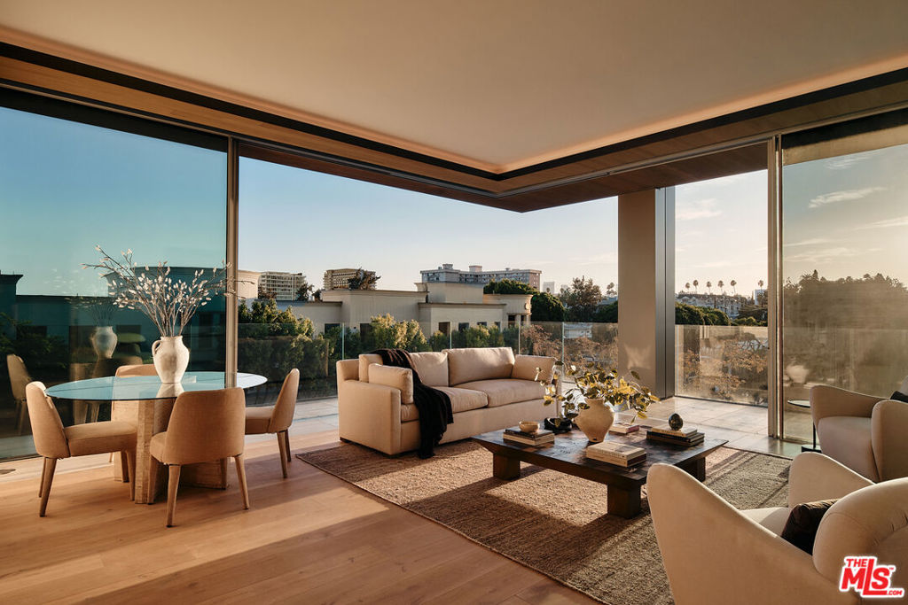 Residence 5C at 8899 Beverly is a meticulously crafted two bedroom, 2.5-bathroom home offering 2,004 square feet of exquisite living space, situated on the sunny southwest corner of one of Los Angeles' most iconic buildings. Designed with livability and sophistication in mind, the thoughtful floor plan provides ideal privacy, with each bedroom suite occupying opposite corners. A separate laundry room adds convenience and functionality to the layout.The primary suite offers two spacious walk-in closets and access to a private terrace. The en-suite bathroom boasts Italian travertine stone flooring, walls, and countertops, with chrome Dornbracht fixtures and an Agape Spoon XL soaking tub positioned beneath floor-to-ceiling windows. Ceilings soar up to 11', while Swiss-made Vitrocsa operable glass window walls create a seamless connection between the indoor living space and the wraparound terrace. The custom chef's kitchen features white oak cabinetry, Italian Calacatta gold marble, and top-of-the-line appliances by Gaggenau, Sub-Zero, and Miele, ideal for both casual meals and entertaining.Residents enjoy a serene, lushly landscaped pool area surrounded by private gardens, offering an oasis of calm in the heart of the city. The outdoor kitchen, dining areas, and cozy fireplace lounges nestled within the garden spaces are perfect for relaxation and social gatherings. Situated in the vibrant heart of West Hollywood's Design District, this residence is just moments from the city's finest dining, shopping, and cultural destinations. Whether exploring the neighborhood or retreating to the peaceful sanctuary of your home. The building's 24 hour valet and concierge services reflect the highest level of residential care. Designed by Olson Kundig as a "love letter to Los Angeles," 8899 Beverly is recognized as the finest residential building in the city, redefining modern luxury with a masterful blend of artistry, innovation, and timeless design. Public Report Renewal with CalDRE pending
