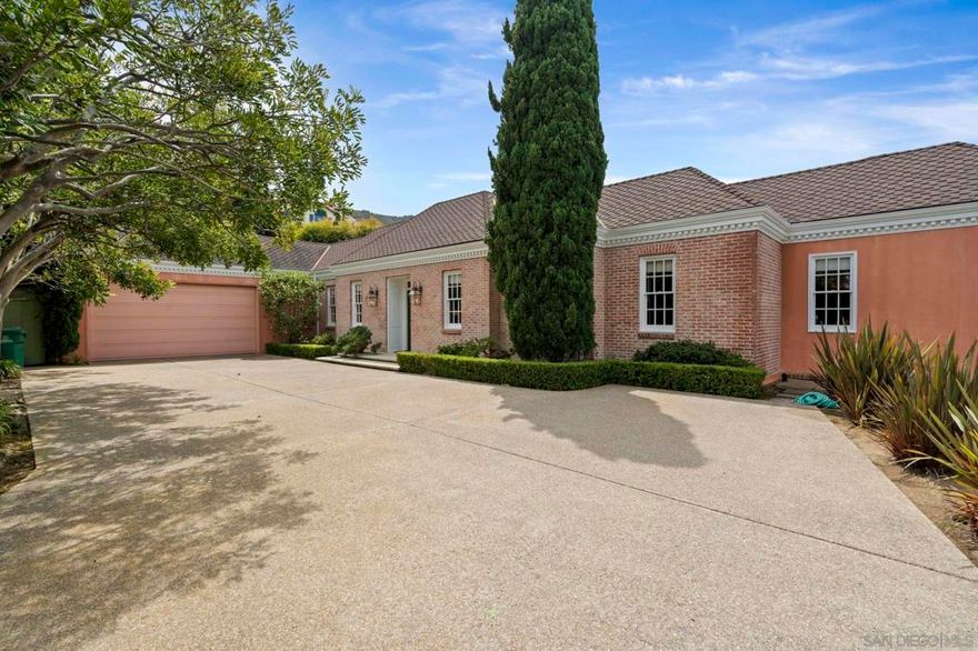 Prestigious, private Hillside Drive location, classic architectural perfection by the esteemed local icon, Rod Youngson, AIA, and an easy-maintenance, easy-access luxury home creates the perfect palette for your curated personal style. Beautifully designed, exquisite soaring tray ceilings are one of the hallmarks of a Youngson home, along with the gracious French doors with traditional individual mullions opening to a lovely view patio with barbecue for dining al fresco. With the primary bedroom suite and dual en suite baths located on the main level with shared living areas and secondary bedrooms on the lower level, this residence offers an easy lock-and-go second or primary home close to the village, beaches, La Jolla Shores, UCSD, Biotech Mesa and freeway access points. A jewel in a superb spot.