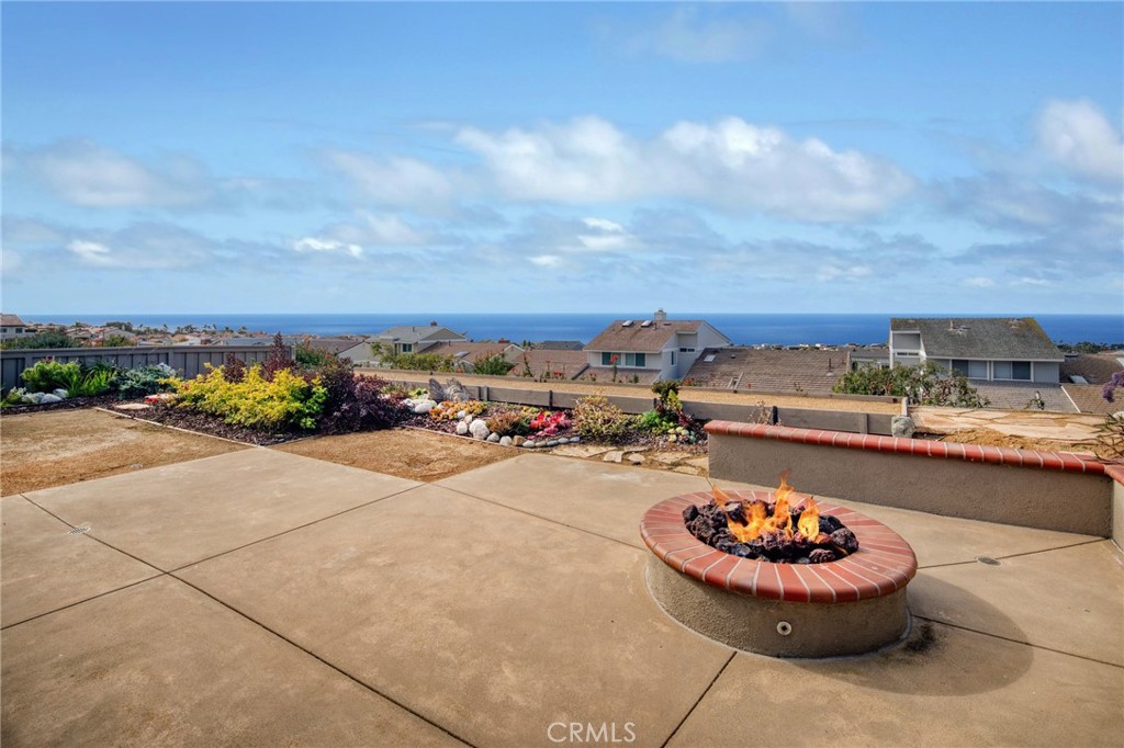Located in the 24-hour gated oceanfront community of NIGUEL SHORES, this beautifully remodeled ONE STORY home boasts panoramic ocean to Catalina Island to Palos Verdes views. This is a seasonal furnished rental. The all-new "Great-Room" and Kitchen captures the spectacular ocean views and includes new furniture, beautiful new cabinetry, glass tiles and stone counter tops plus lovely wood-look flooring throughout. The primary bedroom suite includes a king size bed and full ocean view and the home includes a den/office/TV room plus a lovely secondary bedroom with queen bed. The hall bath highlights a new quartz counter top. This property is situated on a single loaded street overlooking Niguel Shores with easy access to Club and Beach. The back and side yard features amazing ocean views and includes a Bocce Ball court for fun in the sun. The Clubhouse features a Jr. Olympic size pool, spa, Pickleball, Tennis, Sports Courts and park plus the blufftop oceanfront park and parking lot provide easy direct beach access. Enjoy the fun and festive beach lifestyle living in Niguel Shores...The "best-Kept" Secret Along The Coast!
