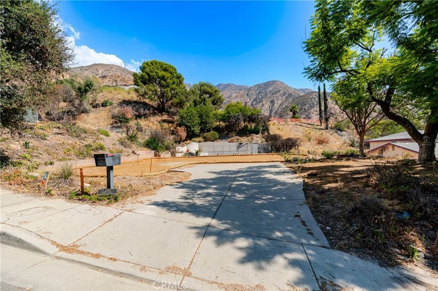 Exceptional Opportunity to Build in Beautiful Altadena. Discover a rare chance to create your dream home in one of Altadena’s most scenic hillside neighborhoods. This expansive 13,085 sq. ft. lot offers breathtaking views that stretch across downtown Los Angeles, to Long Beach and on a clear day, Catalina. The original single-story residence (3 bedrooms, 2 baths, 2,161 sq. ft.) was lost in the Eaton Fire, but the pool and expansive decking remain, ready for restoration and future enjoyment. Phase 2 debris removal has already been professionally completed by the Army Corps of Engineers, saving buyers both time and expense in the rebuilding process. Unlike many areas impacted by the fire, this neighborhood retains its charm—homes across the street survived and are already reoccupied, offering a sense of community and stability. Buyers are strongly encouraged to conduct their own due diligence regarding future development, including utility access and connections, lot boundaries, square footage, zoning, environmental status, and school districts. Please drive by only, do not walk on the property. This is your opportunity to design and build a custom home with spectacular city and mountain views in one of Altadena’s most desirable locations.