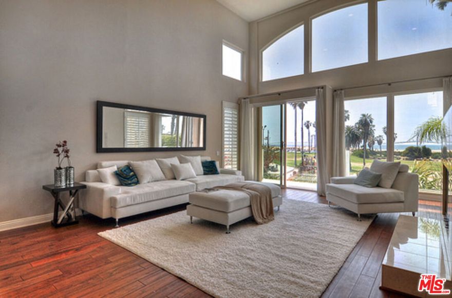 Perfect and Inviting, this panoramic ocean, coastline and Catalina view townhome creates its own oasis. Located in the heart of  the exclusive beach  resort environment at Del Rey Park and Toes Beach, this townhome features pampering amenities to delight the most discerning client. The 3 bedroom. 3.5 bath 2500 square foot home boasts an easily accessible rooftop deck, oversized garage, updated kitchen appliances, hardwood floors and a separate loft/office/bonus room. recessed lighting, lots of storage, cabinet and counter space, laundry room, extra storage and more! This idyllic beach location has park with  a kiddie playground across the street , is a short walk to downtown Playa, the Beach and and  the bike path. It is conveniently close to all freeways, LAX and is the hub of the Silicon Beach communities. Just a bike ride or walk to Marina Del Rey, El Segundo and Manhattan Beach, and a short drive to Venice, Culver City and South Bay Beaches. But there is a quiet serenity here. Playa Del Rey Lagoon's attraction for so many is the separation it offers from the noise, pollution and chaos of the city.  It invites you to participate in everything a beach community offers, but it allows you to just be an observer and enjoy the ambiance of a unique lifestyle.