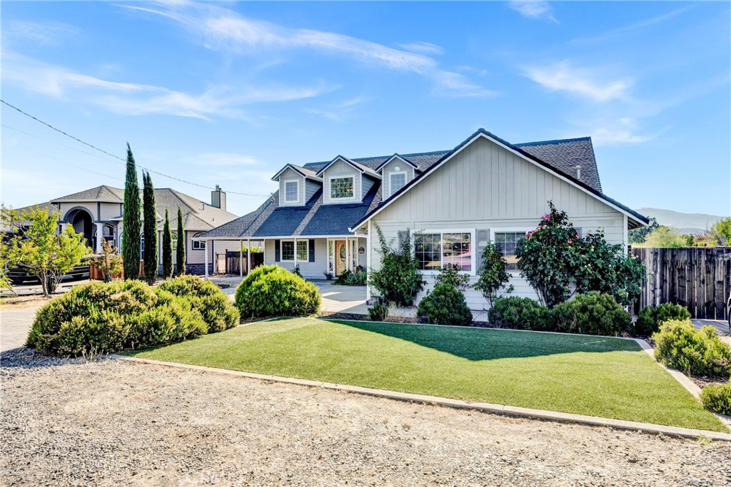 Welcome to 18695 Horseshoe Rd, a stunning single-level home in the gated community of Hidden Valley Lake offering style, function, and a resort-like outdoor experience. Enjoy an open floor plan, soaring ceilings, and custom finishes throughout.
Step inside to a spacious great room with abundant natural light, creating a bright and airy ambiance. The living area is perfect for entertaining or relaxing and flows seamlessly into the spacious dining space and kitchen. The kitchen boasts newer stainless steel appliances, ample cabinetry + pantry, and a large center island ideal for meal prep or casual dining.
The primary suite is a peaceful retreat with vaulted ceilings, a large walk-in closet, and direct access to the backyard. The en-suite bathroom offers dual sinks, a soaking tub, and a separate walk-in shower. Two additional bedrooms share a well-appointed Jack and Jill bathroom—perfect for family or guests.
Enjoy the convenience of an indoor laundry room and a dedicated 2-car garage, plus a separate golf cart garage and extended parking pad with space for all your toys. Owned solar panels and a Tesla Powerwall provide energy efficiency and peace of mind.
Step outside to your private backyard oasis! Entertain in style with a full outdoor kitchen featuring a CalFlame 6-burner grill under a charming pergola. Unwind in the hot tub or take in the views of your producing hobby vineyard—planted with approximately 80% Tempranillo and 20% Cabernet Sauvignon.
A stamped concrete driveway adds curb appeal, while the fully fenced side yard offers privacy, extra parking, or space for gardening and pets. With all living on one level and every upgrade thoughtfully designed, this property blends luxury, sustainability, and functionality in a wonderful Hidden Valley Lake location that backs up to Putah Creek for privacy! Ask about seller financing at 5% interest!!