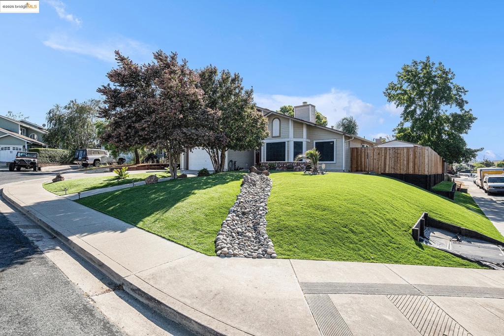 Welcome to 80 Mandeville Ct—an upgraded single-story gem tucked on a quiet Oakley court! This home features new landscaping with turf, spacious sideyards, and great curb appeal. Inside, you'll love the new flooring throughout, a redesigned kitchen layout with modern finishes, and a farmhouse sink perfectly positioned under a window for natural light and charm. The dual-sided fireplace adds warmth and character, connecting both the living and family rooms for an ideal entertaining setup. The main bathroom has been completely remodeled with custom tilework and upscale finishes, giving it that designer touch. Enjoy peace of mind with a newer HVAC system and smart upgrades throughout. Whether you're relaxing at home or entertaining guests, this home delivers both style and function. Located just minutes from shopping, dining, and freeway access—this location is as convenient as it is quiet.