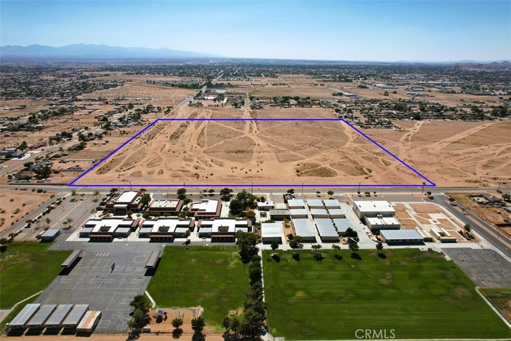 Attention Builders, Developers, and Investors – Prime ± 40-Acre Residential Development Opportunity (R-SF Zoned)
Don’t miss this rare opportunity to acquire 40 acres of flat, buildable land zoned Single Family Residential (R-SF), ideally suited for residential subdivision development. This zoning allows for single-family detached homes in areas supported by existing or planned infrastructure and services, with a minimum lot size of 0.4 net acres (18,000 square feet). The dominant use is residential, offering strong potential for a thoughtfully designed, lower-density community in one of the High Desert’s emerging growth areas.
This property is centrally located and directly across the street from Vanguard Preparatory School—an attractive amenity for future homeowners and families. Its strategic location offers convenient access to Highway 18 to the north and Bear Valley Road to the south, connecting residents to nearby shopping, schools, and employment hubs. With increasing demand for housing and limited supply of quality residential land, this parcel presents a compelling investment for those looking to build or hold in a market poised for continued growth.
Buyers are strongly encouraged to conduct their own due diligence. All information should be independently verified to confirm buildability, land use regulations, available utilities, and other property-specific details. Please consult with the San Bernardino County Planning/Building Department, local utility providers, or qualified professionals to obtain the most accurate and current information.