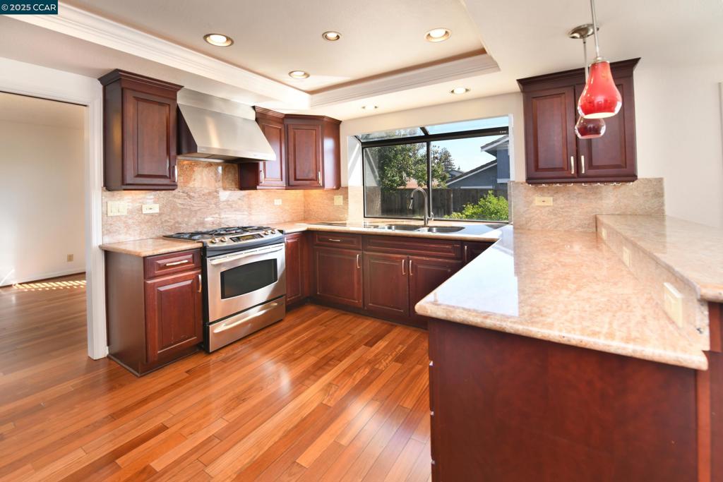 Welcome to an upgraded residence in desirable Hidden Lakes. Built by SOC, this home blends timeless charm with modern sophistication, offering a lifestyle of comfort, efficiency, & style. Step inside to discover a chef’s kitchen, thoughtfully renovated with premium appliances & custom cabinetry. Plantation shutters adorn every window, adding elegance & privacy. The lower-level features Brazilian Cherry flooring, while the upper level has plush new carpeting. A full interior repaint brings a crisp, contemporary ambiance to every room. Equipped for energy-conscious living, with 18 solar panels and a Tesla Powerwall battery that can significantly reduce electric consumption. The garage has a Tesla EV charger. Climate control is a breeze w/an upgraded dual-zone A/C system with independent controls. New master closet designed by California Closets offering sleek organization & style. The guest bathroom was fully remodeled in 12/2024, featuring a walk-in shower & state-of-the-art fixtures for a spa-like experience. All toilets equipped with electric bidets, elevating everyday comfort & hygiene. The yards showcase water-tolerant landscaping, combining beauty with low maintenance. A refined retreat tucked on a court to add additional privacy! Feel the difference & eco-conscious living!