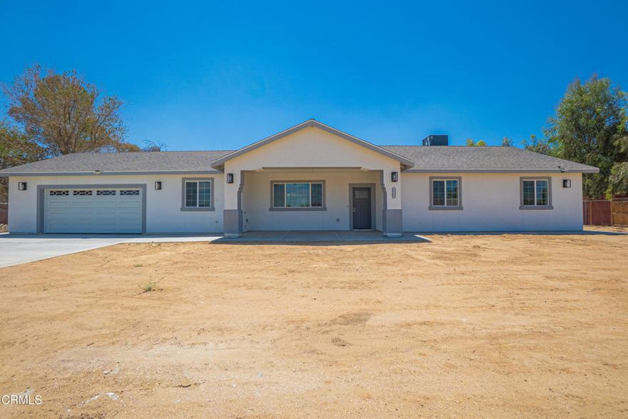 Modern Comfort Meets Spacious Country Living! This stunning Contemporary Ranch-style home offers 1,548 S.F. of beautifully designed living space with 3 bedrooms and 2 bathrooms, perfectly situated on a 0.91-acre flat lot--ideal for RV parking, a workshop, an ADU, or your dream outdoor retreat. Built for efficiency, this home is all-electric with no gas lines and features owned solar panels, providing long-term energy savings and a cleaner, greener way of living. Inside, the open-concept layout flows seamlessly from the light-filled living area to the stylish kitchen and dining spaces, making it perfect for everyday living and entertaining. A welcoming covered front porch sets the tone for the home's charm, while the oversized 856 S.F. two-car garage offers abundant space for vehicles, storage, or hobbies. With its blend of modern style, energy efficiency, and nearly an acre of flat, usable land, this property delivers comfort, functionality, and endless potential in one incredible package.