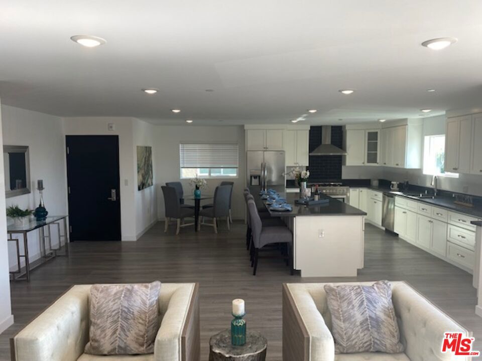 Newer construction, elegantly designed, just finished in 2022, California luxury living. The building is comprised of only 3 units, one per floor, no adjoining wall with elevator opening to each unit with access code, Secured gated entry with key code. Open floor plan, living, dining, that leads to a large patio. Grand, gourmet family kitchen, island w sitting over 10 people around, great for cooking and entertainment. Other features: High ceilings, LED recessed lighting, engineered wood throughout, double pane windows, walking closet, washer dryer inside the unit and much more. Centrally located, minutes away from Beverly Hills, WHO, Culver city, LMU, Metro line, shops, and freeways. A must see !!