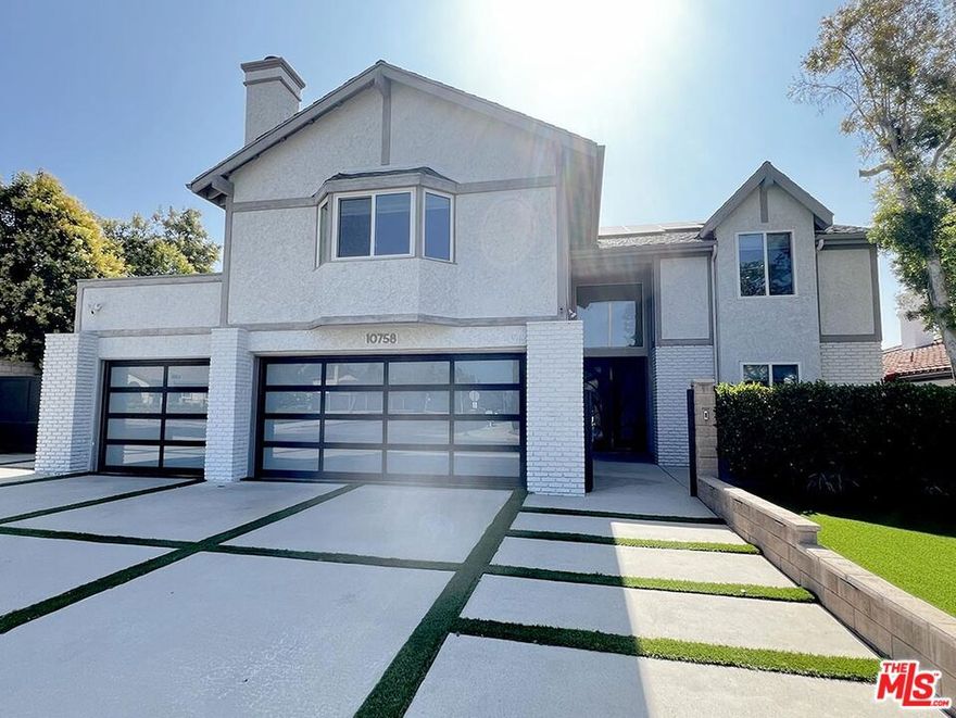 Welcome to easy living in Chatsworth! Fully remodeled in 2021, this home is located in a quiet pocket of the valley on a cul-de-sac. Three car garage, EV charging for two vehicles, and additional driveway parking.The kitchen has stainless steel appliances (2 ranges, 3 ovens, 2 sinks, 72" fridge & freezer, and drawer microwave) and quartz counters. The kitchen is open to a family room area with TV wall, while the separate formal living room features a fireplace and the dining room features a built-in bar and wine fridge. Multiple sliders open to the outdoor entertaining area. Ground floor bedroom with its own bathroom (with walk-in shower) is located near the front entrance. The laundry room is on the ground floor. In the upstairs loft area you'll find a screening/movie room with projector and an office/homework nook around the corner. Massive primary suite, including a private balcony, walk-in closet and makeup/hair area. The en-suite bath features a soaking tub, large walk-in shower, dual sink vanity, and separate water closet with toilet and bidet. Three additional bedrooms are located on the second floor. The large backyard features a saltwater pool, spa, sauna, outdoor shower and outdoor kitchen. Covered patio with outdoor TV. The neighborhood is a welcoming and friendly community.  Conveniently located near Sierra Canyon School, the shops, restaurants and movie theaters at The Vineyards at Porter Ranch, Whole Foods,Trader Joes, Ralphs, Mendocino Farms, Ulta and 118 freeway access are all just a 5 minute drive away. Please note, there are additional maintenance fees as follows:Pool Maintenance is $160/month, Landscape is $120/month, Alarm system is $95/month, Solar lease is $125/month TOTAL MAINTENANCE COSTS: $500