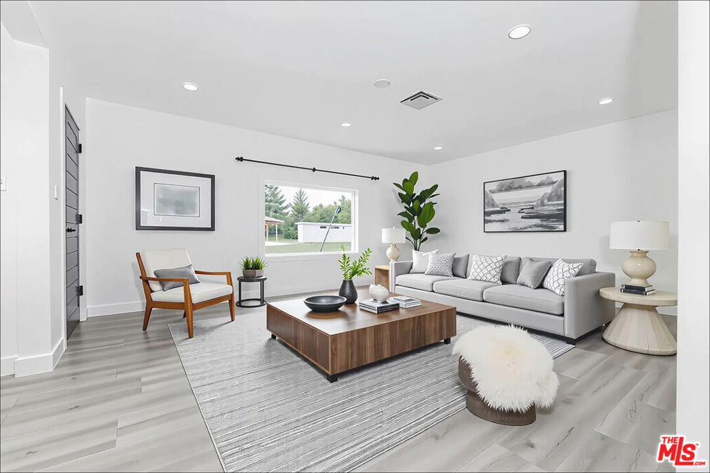 Welcome to this beautifully remodeled 3-bedroom, 2-bathroom home in the heart of Woodland Hills. Perfectly blending modern upgrades with everyday comfort, this residence features an open and airy floor plan, a sleek updated kitchen with stainless steel appliances, recessed lighting and an individual laundry area. The spacious living areas are ideal for entertaining or relaxing, while the private backyard offers room to enjoy outdoor living. The enlarged detached garage can fit two large vehicles easily or become home to your new workshop. Located just minutes from Westfield Topanga Mall, The Village, and the 101 freeway, you'll have quick access to shopping, dining, and commuting. Families will also appreciate the home's proximity to highly regarded schools. Move-in ready and designed for convenience, this Woodland Hills gem is a must-see. (Some images have been virtually staged)