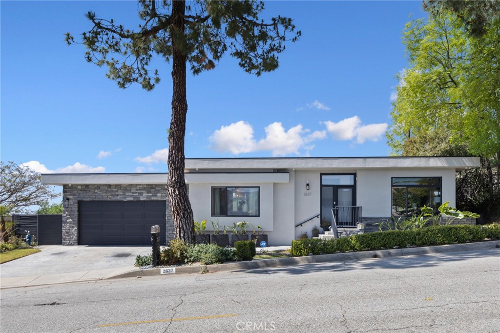 Welcome to 2637 N Mountain, a custom architectural gem in Claremont’s prestigious Claraboya community. This stunning 2007-built home has been extensively upgraded with high-end designer finishes, offering panoramic views of the mountains, valley, and city lights.
Spanning 3,260 sq ft, the home features a modern open layout filled with natural light, floor-to-ceiling Milgard windows, imported Italian marble, and dazzling Tiffany crystal chandeliers. The chef’s kitchen boasts Thermador appliances and opens to the family room with seamless indoor-outdoor flow—perfect for entertaining or peaceful retreats.
The luxurious primary suite occupies the entire lower level and includes a private bar lounge, dual walk-in closets, heated bathroom floors, and Robern smart mirrors for a refined, resort-like experience.
Sitting on a 20,000+ sq ft lot, this home offers both privacy and potential—just minutes from The Webb Schools, Claremont Colleges, and Claremont Village. Rarely does a turnkey view home of this caliber come to market—don’t miss this opportunity.