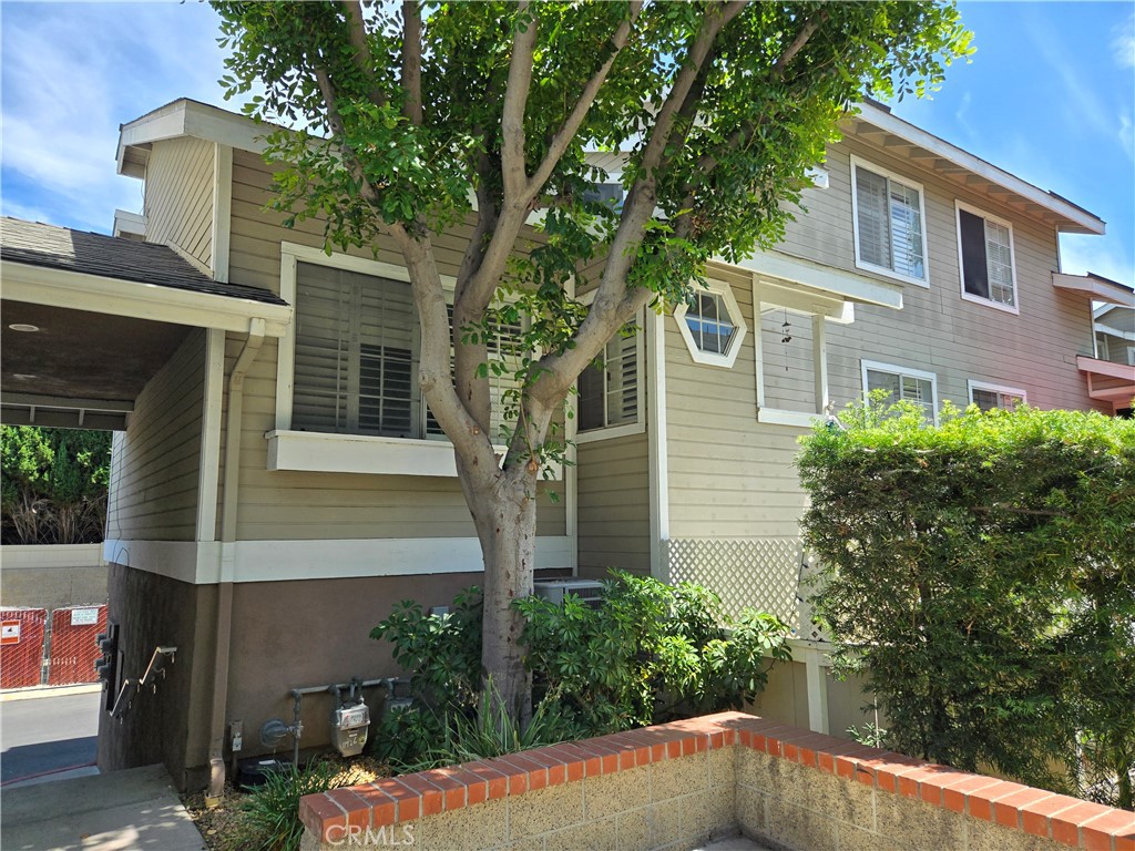 Townhouse-style condo located in the highly desirable gated community of Brookhaven Circle. With its prime location, this unit offers the perfect blend of privacy and convenience. Boasting 2 bedrooms, 2 baths, and a 2-car garage right below the unit. As you step inside, you'll be greeted by a bright and open floor plan enhanced by a vaulted high ceiling. The spacious living room features laminated wooden flooring. The dining area seamlessly flows into the kitchen, which showcases recessed ceiling lights and ample cabinetry. One bedroom and a full bathroom are conveniently situated on the main level. Upstairs, the roomy master suite awaits, complete with a vaulted ceiling, a walk-in closet, and a master bathroom featuring a linen closet and a skylight above the shower. Convenient indoor laundry room, central A/C & heating for year-round comfort. The patio, perfect for entertaining and relaxation, adds an outdoor retreat to this wonderful home. Rent includes water and trash services, as well as access to the community pool, spa, and outside maintenance. Washer, dryer, and new refrigerator are included for added convenience. Guests will appreciate the abundance of parking spaces available. Ideally located near Little Saigon, Korea Town, schools, shopping, markets, fitness clubs, and entertainment venues.
