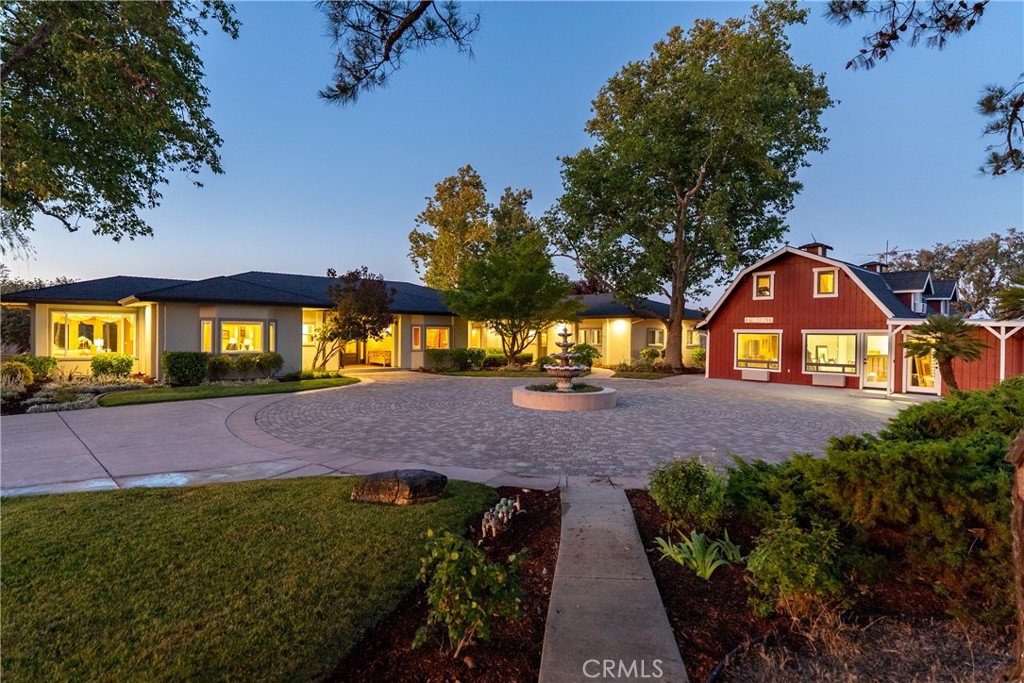Dreams Come True with this Incredible Central California Coast Estate! We are proud to present this extraordinary opportunity to own one of the most breathtaking and versatile ranch properties to be had in the heart of Paso Robles wine country. Set on 107 gently rolling, oak-studded acres with breathtaking 360-degree views, this iconic ranch offers the perfect blend of privacy, convenience, and prestige - and all located just a few miles to Paso Robles Golf Club, regional shopping and dining, K-12 schools, etc. The property features four (4!) residences, including two with active vacation rental licenses, making it ideal for multi-generational living, income potential, or developing an exclusive, private retreat. The lavish, 3,500 SF single-level main residence was custom built around 2003 and features 4 Bedrooms (3 of which are en-suite), 3 fireplaces, and attention to detail that must be seen to be understood. A second 2,100 SF 3 Bdrm residence was also custom built in 2005, and also won't disappoint in features or amenities. Care-takers or extended family will appreciate the third and four living arrangements as well - one being a 1,400 SF 3 Bdrm manufactured home and the other a super cute 1 bedroom residence called the 'Farmhouse'. There is an additional 1,000 SF of improved office space (prior owners operated their business from the property), as well as a sizable studio space with 2 vehicle access doors. Additional improvements (yes, there's still more!) include a 2,000± SF shop building, owned solar, 10,000 gallon in-ground water storage, an improved RV pad (with utility connections), extensive landscaping and fencing and more. The improvements are certainly impressive - if not overwhelming in the opportunities they provide. But the real foundation of this ranch lies in the breathtaking land that these improvements rest upon. When one dreams of a ranch in Wine Country, it is likely THIS land that provides the canvas for their picture of happiness. Completely usable. Gently rolling. Scattered in majestic Oaks.... and surrounded by picturesque vineyards. Imagine having a property spanning well over half a mile end to end, yet being only 5 minutes away from your Starbucks Caramel Macchiato fix. Properties of this scale, quality, and location rarely come to market and this truly is a once-in-a-generation offering. Be sure to check out the virtual tour & video for more details on this amazing property! NOTE: SqFt & BR/BA count combines 3 homes.