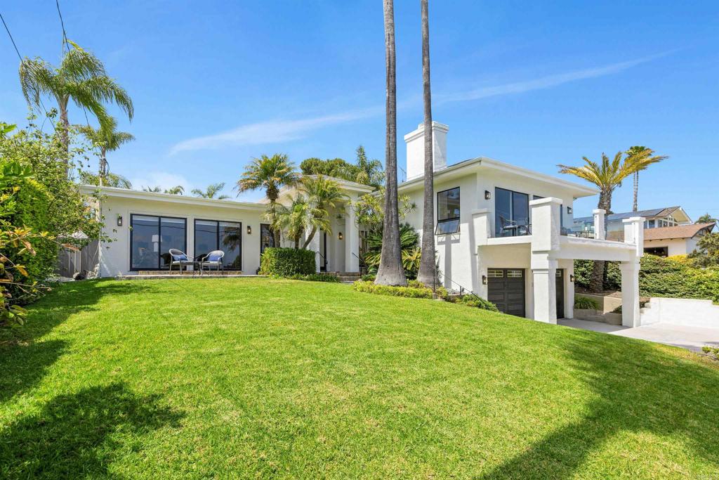 OFFERED UNFURNISHED - $19,995 or FURNISHED $21,500. Enjoy stunning ocean views from this beautifully refined and refreshed home in the prestigious Muirlands community, overlooking downtown San Diego, the bay, sunsets, and evening fireworks from distant SeaWorld. Thoughtfully designed for those who love to host, this single-level home, elevated above the street, offers a gracious welcome and stylish coastal California vibe. With a functional, open floor plan that wraps around a private backyard oasis, every space is carefully planned to facilitate gathering, connection, and everyday living with ease. Outstanding features include an updated kitchen with an oversized center island, an open dining room leading to the expansive backyard, which boasts a solar-heated lap pool and spa, a grassy area ideal for al fresco dining, and ample space to lounge privately around the pool. This home truly embodies a comfortable, easy-living lifestyle, offering a generous 11,600 square foot usable lot. Enter the property through the oversized driveway, spacious enough for kids to play or to accommodate multiple cars. Once inside, the formal entry opens to a free-flowing floor plan for casual living. The beautifully designed kitchen shares a generous dining area large enough for a table of 12. The grand kitchen features Carrera marble countertops, an oversized eat-in island, a 6-burner gas range, and stainless steel appliances. The elevated living room boasts a vaulted ceiling, a fireplace, and access to the viewing deck to fully appreciate the views and nightly fireworks display! Featuring four bedrooms and four full baths, including a primary suite with an adjoining retreat/sitting room, complete with a fireplace, and direct private access to the spa located in the luxurious, very private backyard. Conveniently located near La Jolla's vibrant village, this home is also close to highly rated schools catering to the community's educational needs. Enjoy the proximity to miles of sandy beaches, recreational activities, shopping, and much more, making this home an idyllic retreat for discerning buyers seeking the epitome of luxury living.