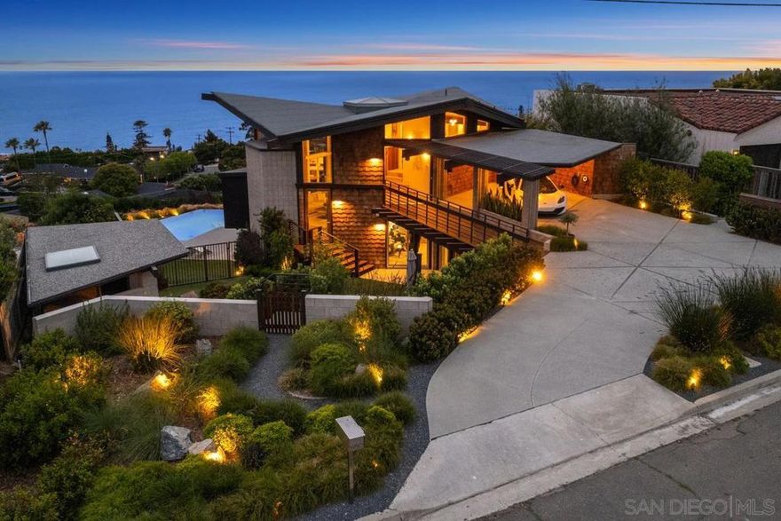 Notable and Award-Winning Mid-Century Masterpiece! Legendary San Diego mid-century architect Loch Crane, an understudy of Frank Lloyd Wright, selected this strategic apex view lot on Avenida Chamnez to construct his personal residence and take advantage of the exhilarating wraparound panorama. Implementing Wright's trademark Hexagonal forms, this property uses masterful architectural intrigue and irreplicable lot position to enhance the unobstructed and expansive views of the Pacific Ocean and beyond. Over 4100 sqft of curated wonder features 4 unique bedrooms and 4.5 luxurious bathrooms. Resort influenced pool suite offers further versatility, stunning ocean views and private patio. The vanishing edge pool and spa design plays along with the home's geometry while the detached Tea House provides yet another area to peacefully sit and enjoy the lush Zen garden and soothing waterfall below. Control 5 Smart Home and Lutron equipped automation. The re-build carefully adhered to Loch Cranes original design in order to preserve historical designation potential.