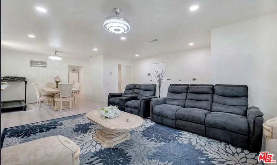 Beautifully renovated and spacious 4-bedroom, 2.5-bath main home available for lease in a well-maintained triplex in Reseda. BASE RENT: $4,995 - UTILITIES: $300. TV, Washer and Dryer included. This home lives like a private single-family residence with its own entrance, generous square footage, and modern upgrades throughout. Step into a large, bright living room featuring a custom stone fireplace and an open layout ideal for everyday living and entertaining. The updated kitchen offers ample cabinetry, expansive counter space, and excellent functionality for cooking and hosting. All bedrooms are well sized, including an oversized primary suite with a private remodeled bathroom and abundant closet space. Additional upgrades include refreshed flooring, remodeled bathrooms, updated lighting, ceiling fans, and modern finishes that provide a clean and move-in-ready feel. The layout offers versatility for families, work-from-home needs, or shared living arrangements. Conveniently located near schools, parks, transportation, shopping, dining, and CSUN. Enjoy a residential neighborhood atmosphere with excellent accessibility to the best of the San Fernando Valley.  A great opportunity to lease a spacious and updated home in a desirable and centrally located neighborhood.